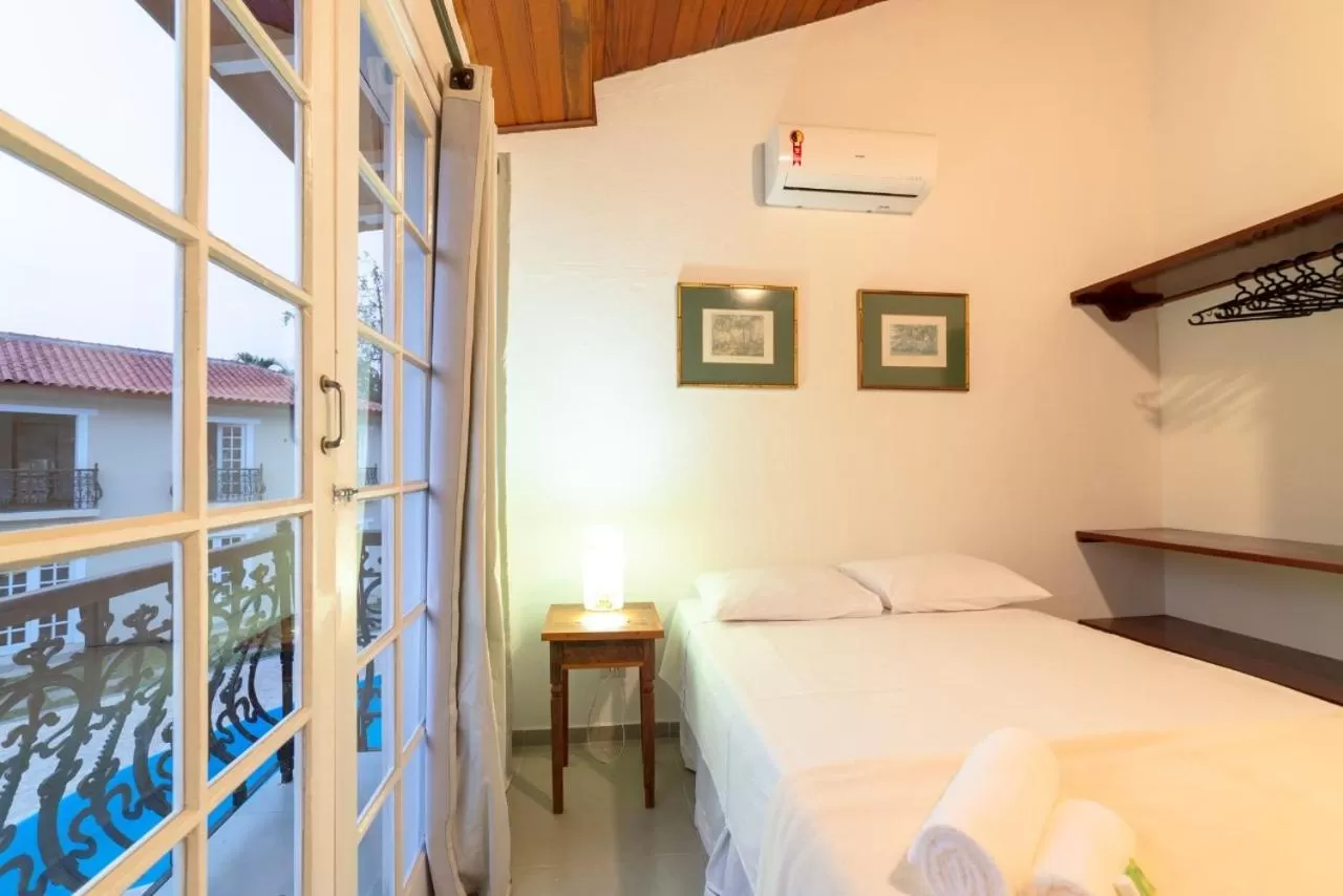 Bed in Pousada Portal de Paraty