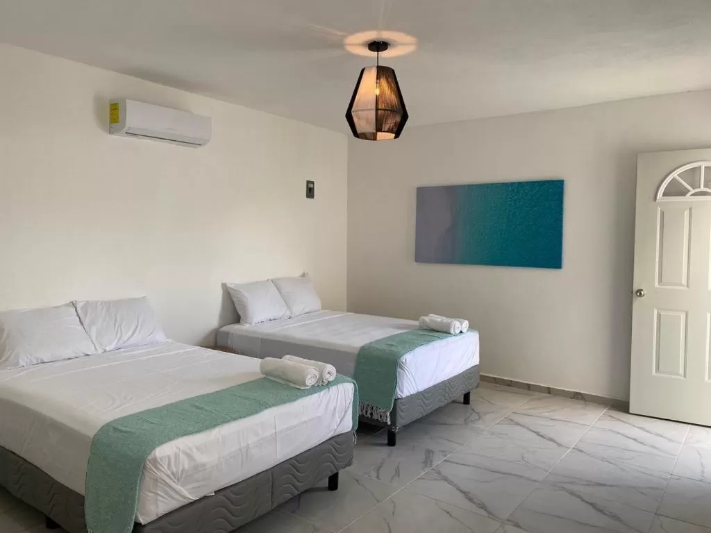 Bed in Casa Colibrí El Cuyo