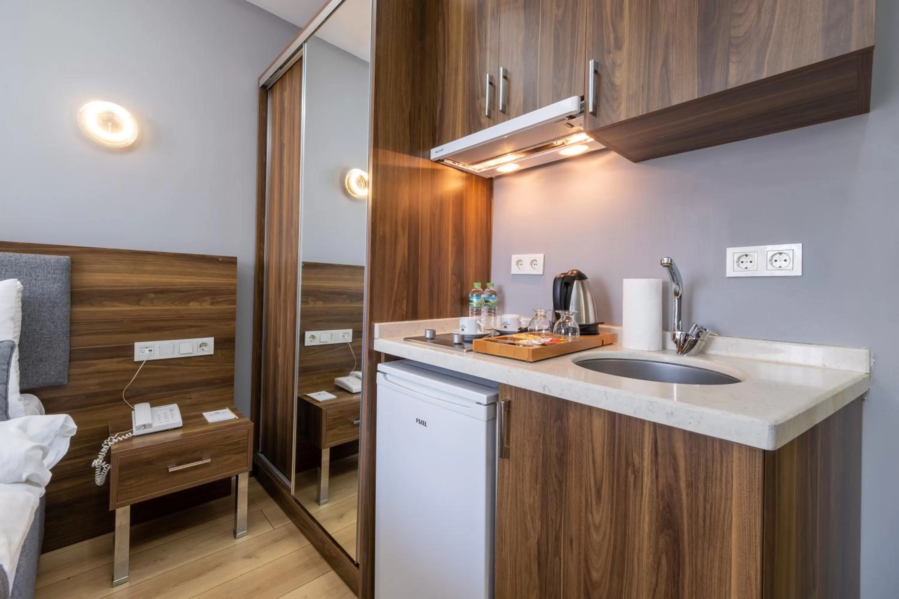 Bed, Kitchen/Kitchenette in Beyzas Hotels & Suites