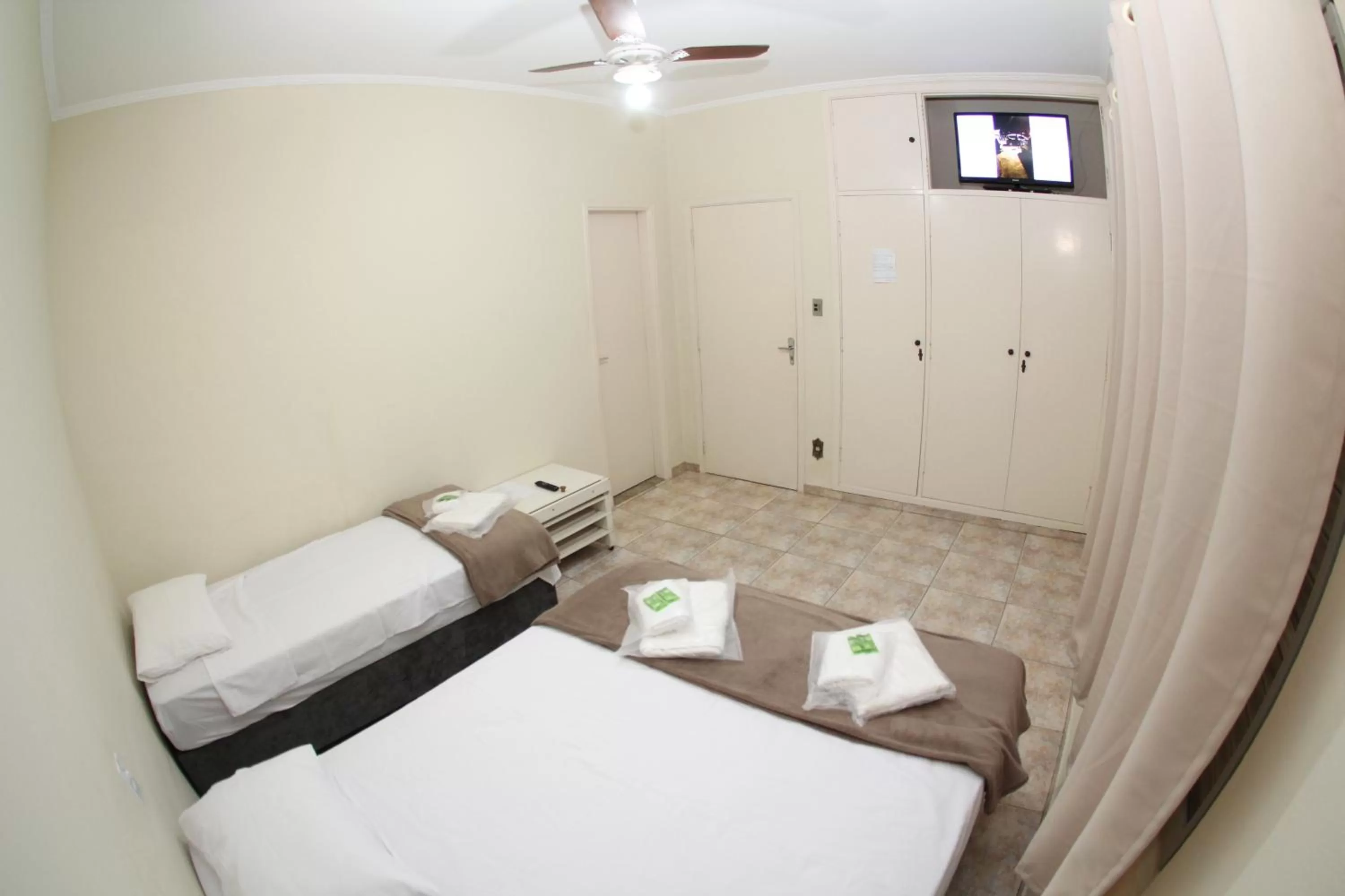 Bed in Pousada Santa Genebra