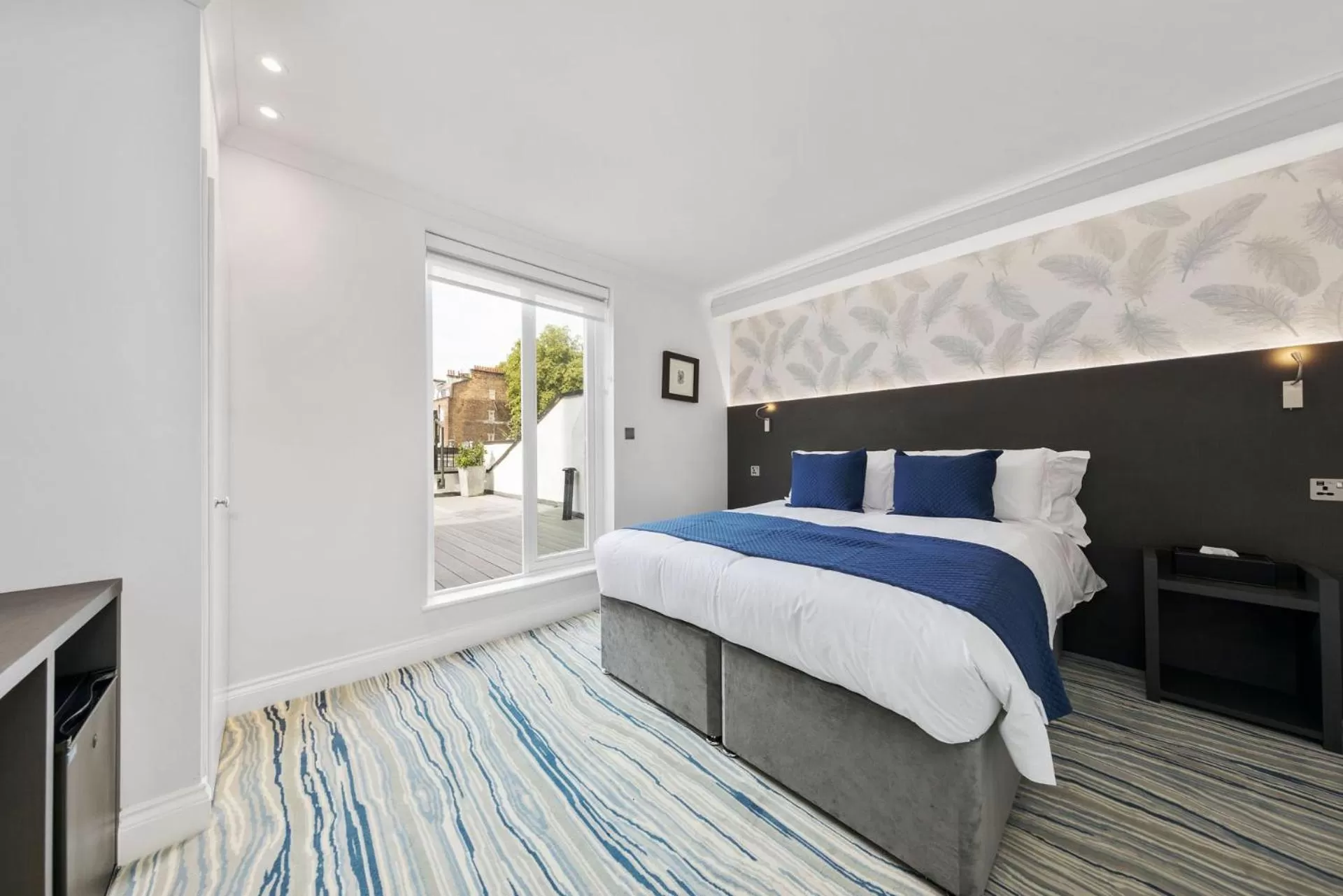 Bed in Commodore Hotel