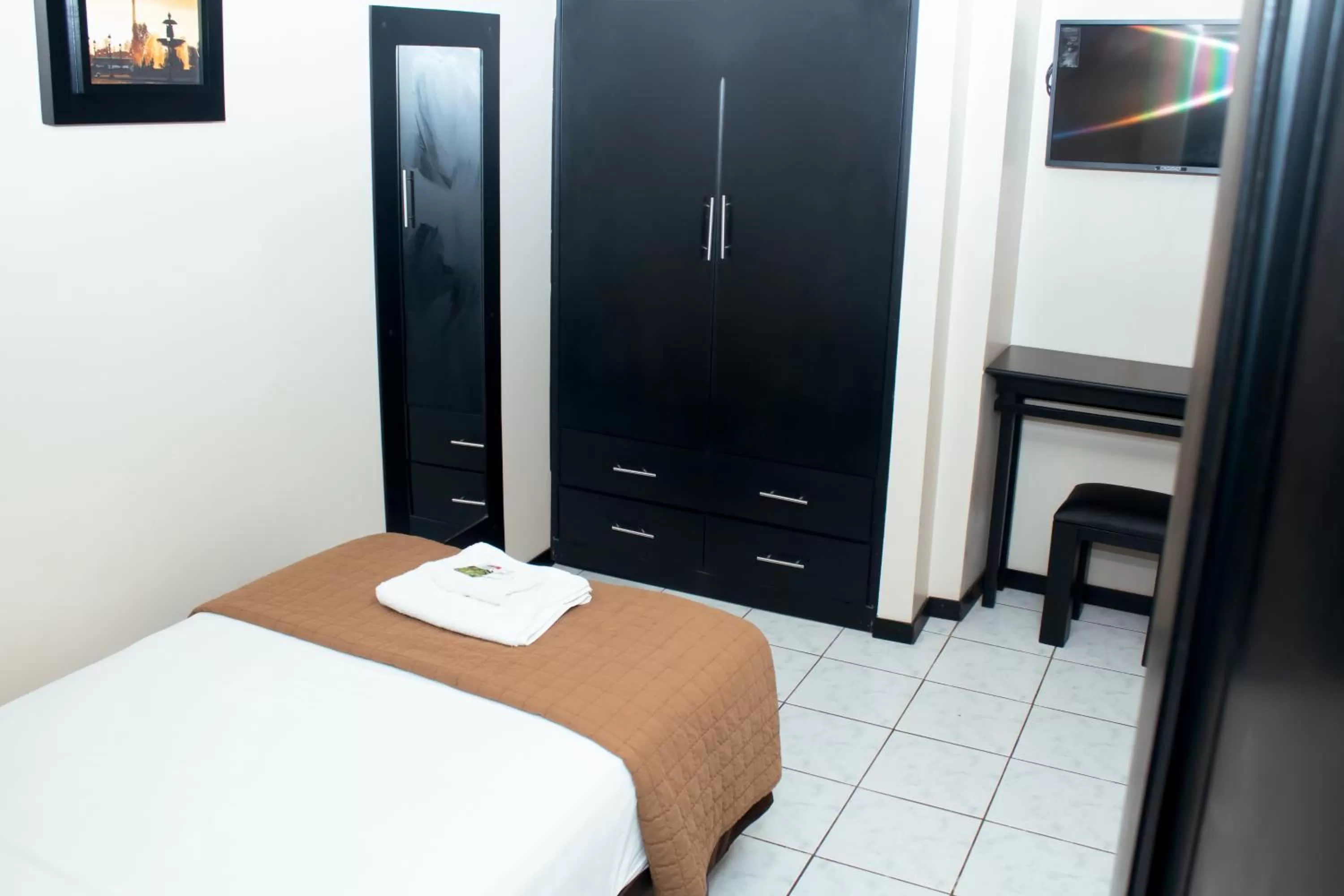 Bed in Paris Suite Hotel