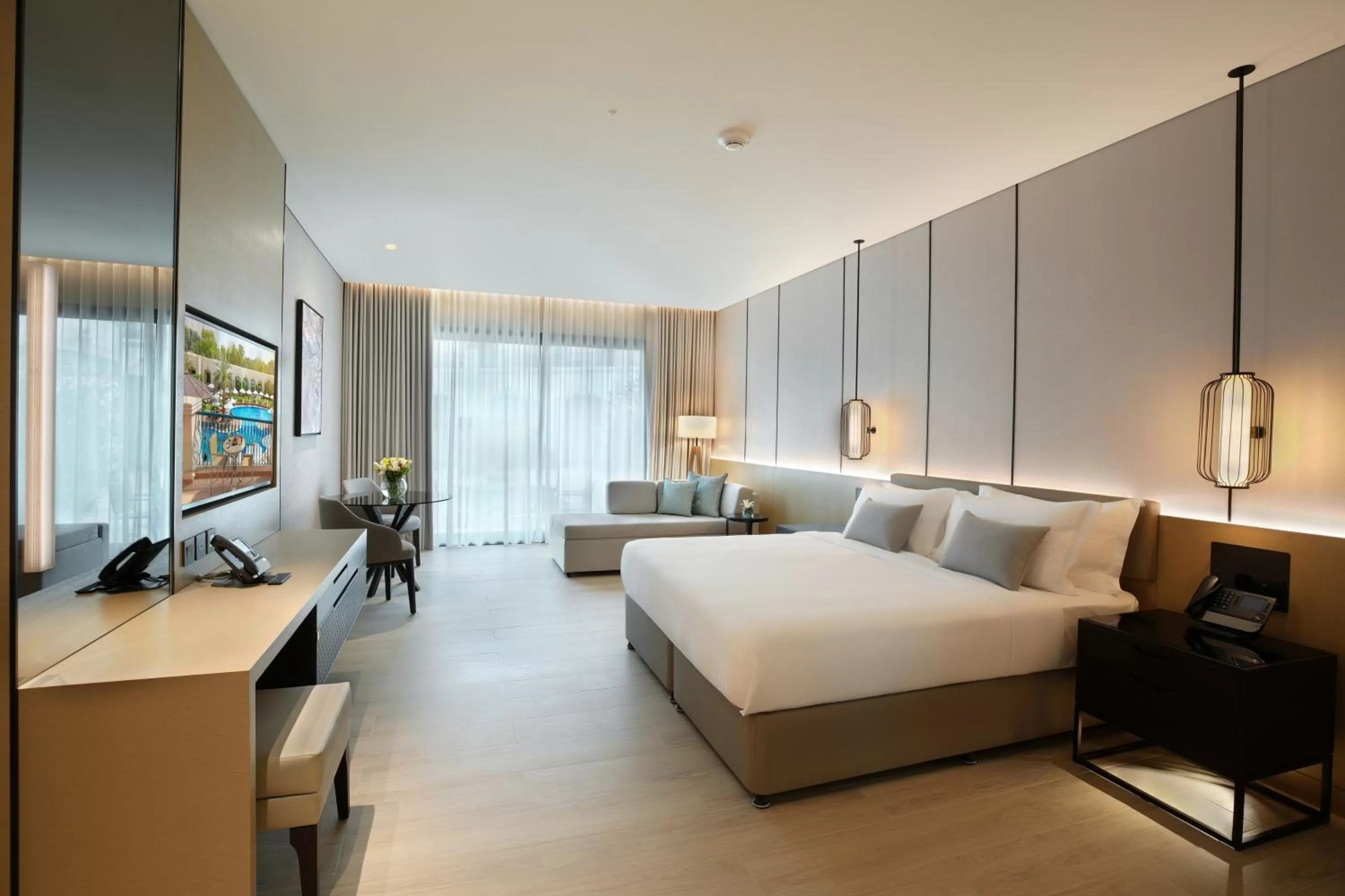 Living room, Bed in Al Ain Rotana