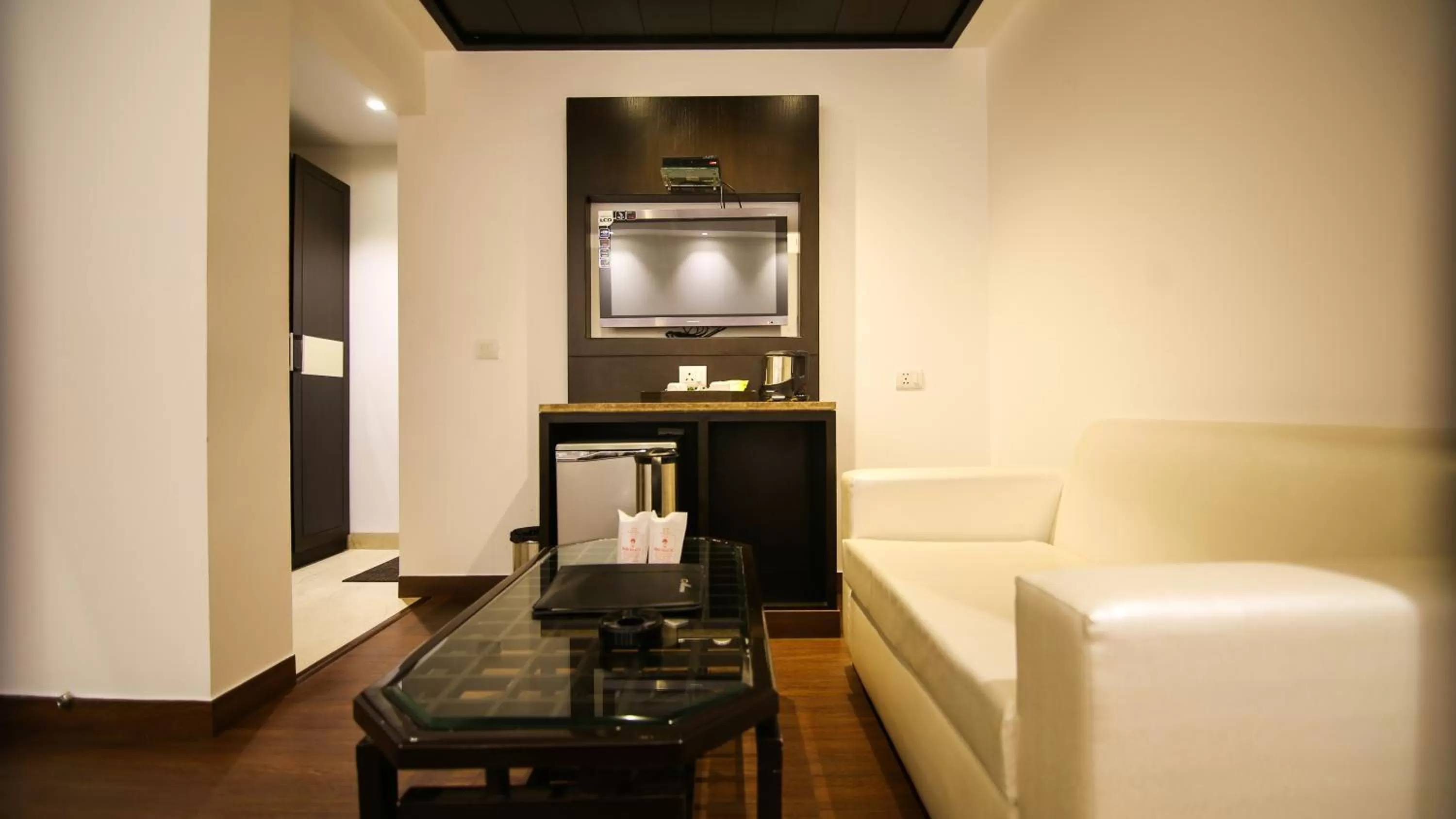 Seating area in Hotel The Prime Balaji Deluxe, City Centre, With Free Airport Pickup