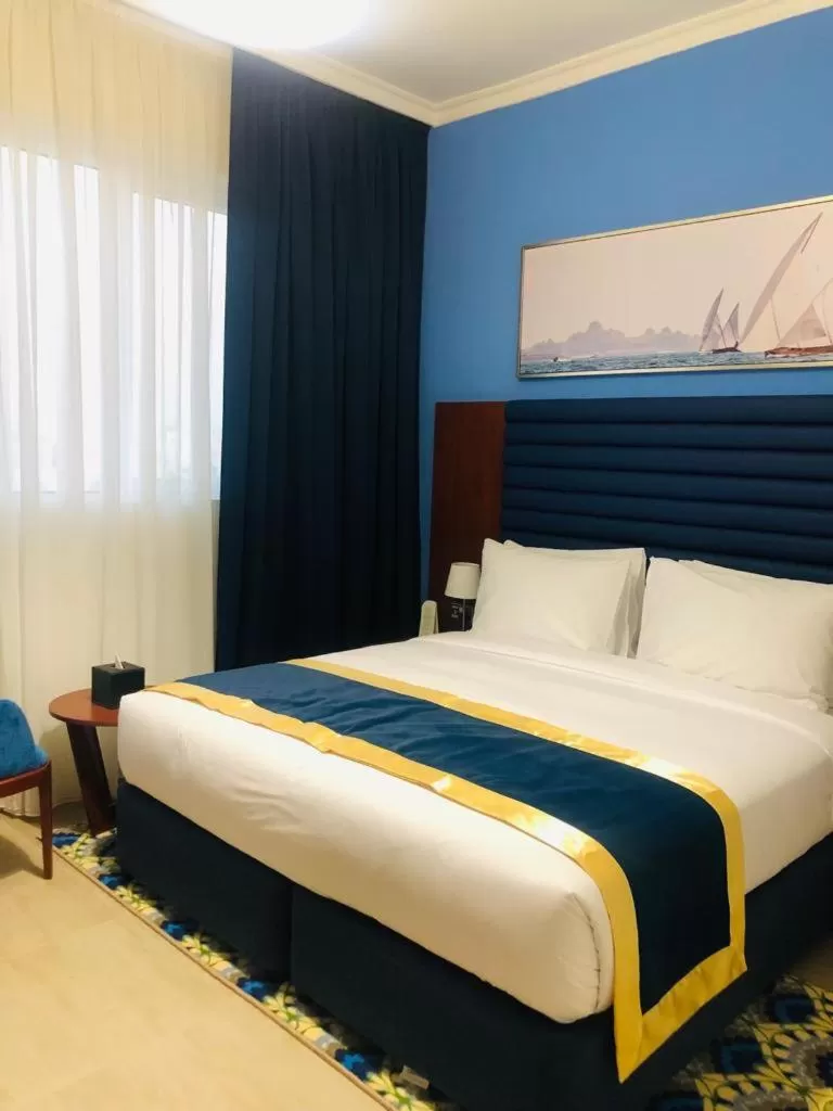 Bed in BANIYAS PLAZA HOTEL APARTMENTS