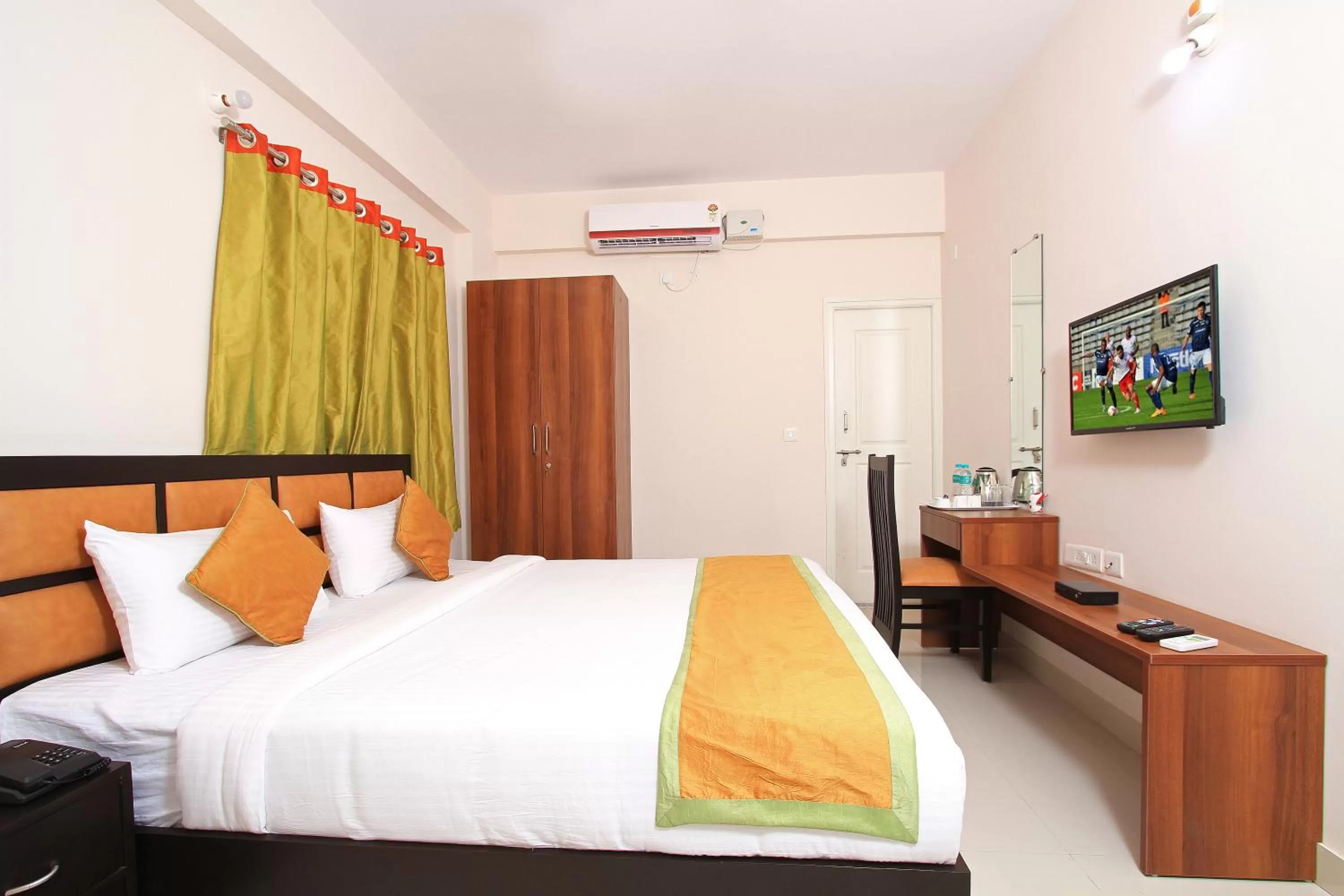 Bed in Arra Suites kempegowda Airport Hotel