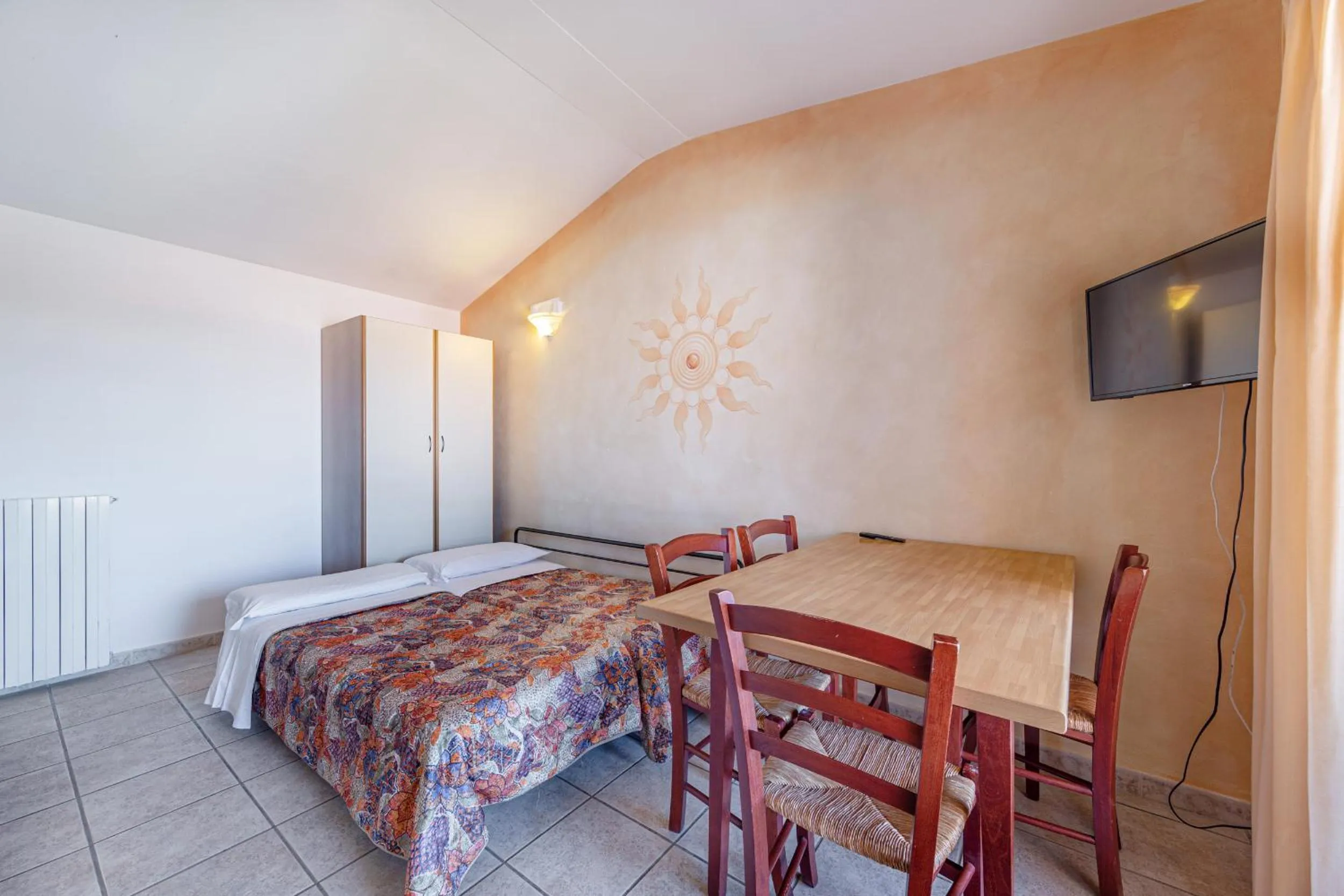 Bed in Marina Manna Hotel and Club Village