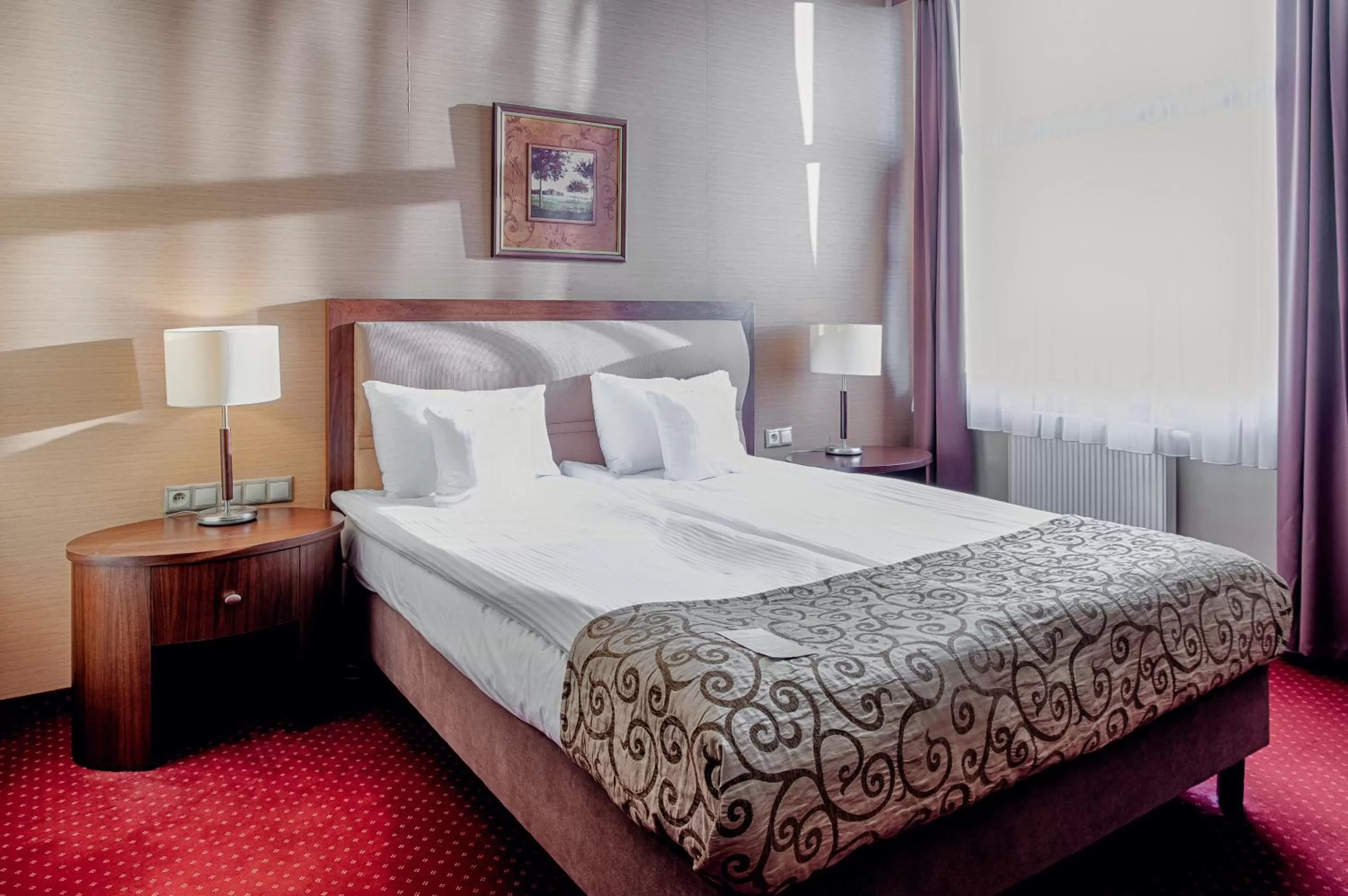 Bed in Grand Royal Hotel