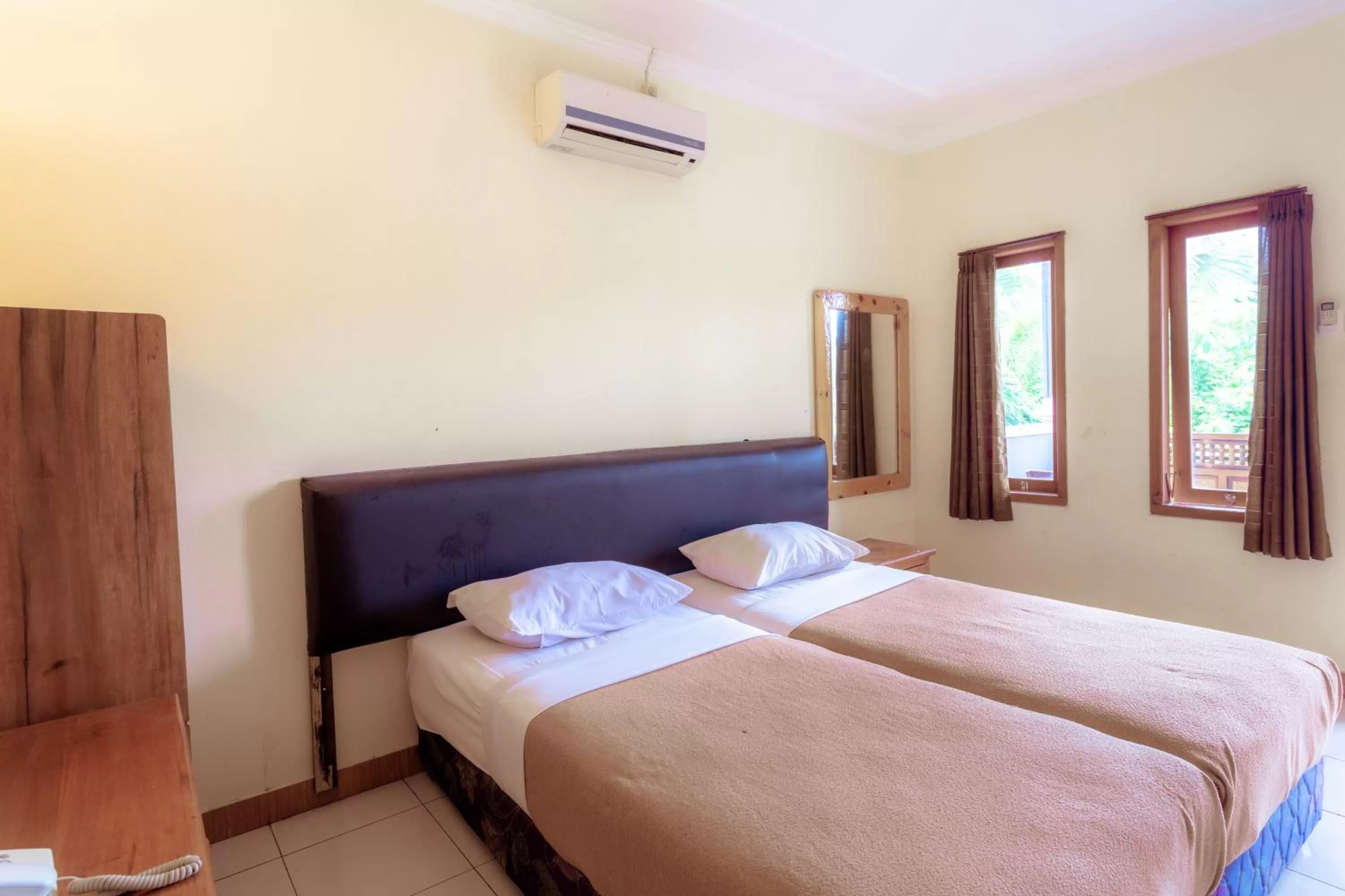 Bedroom, Bed in Hotel Mahkota Plengkung by ecommerceloka