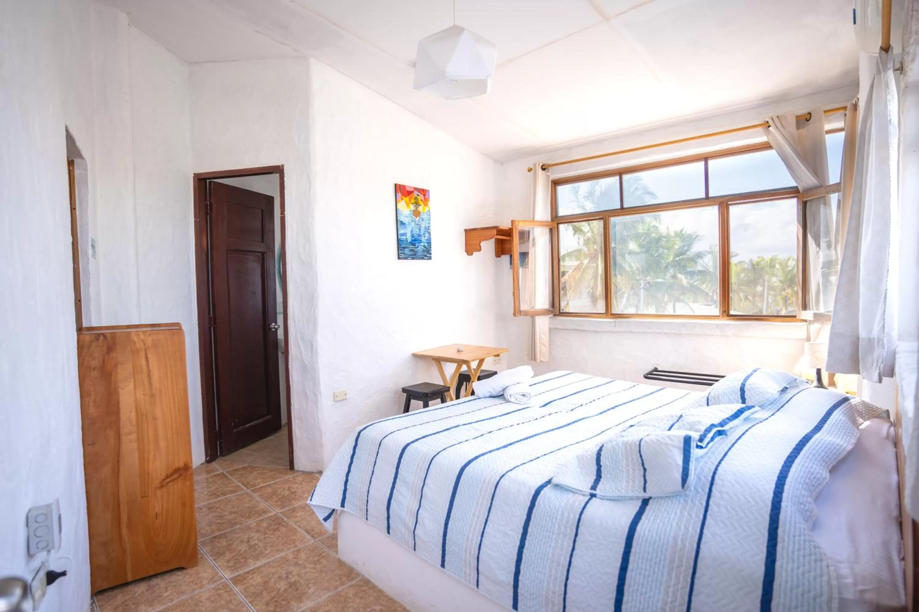 Bed in Hostal Galapagos by Bar de Beto