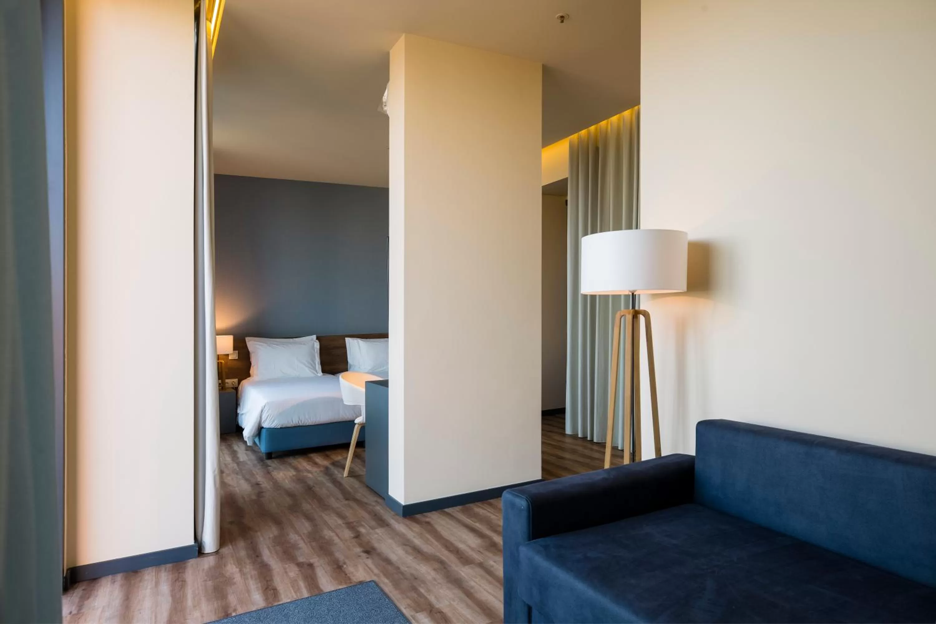 Living room, Bed in The Prime Energize Hotel & SPA - Algarve