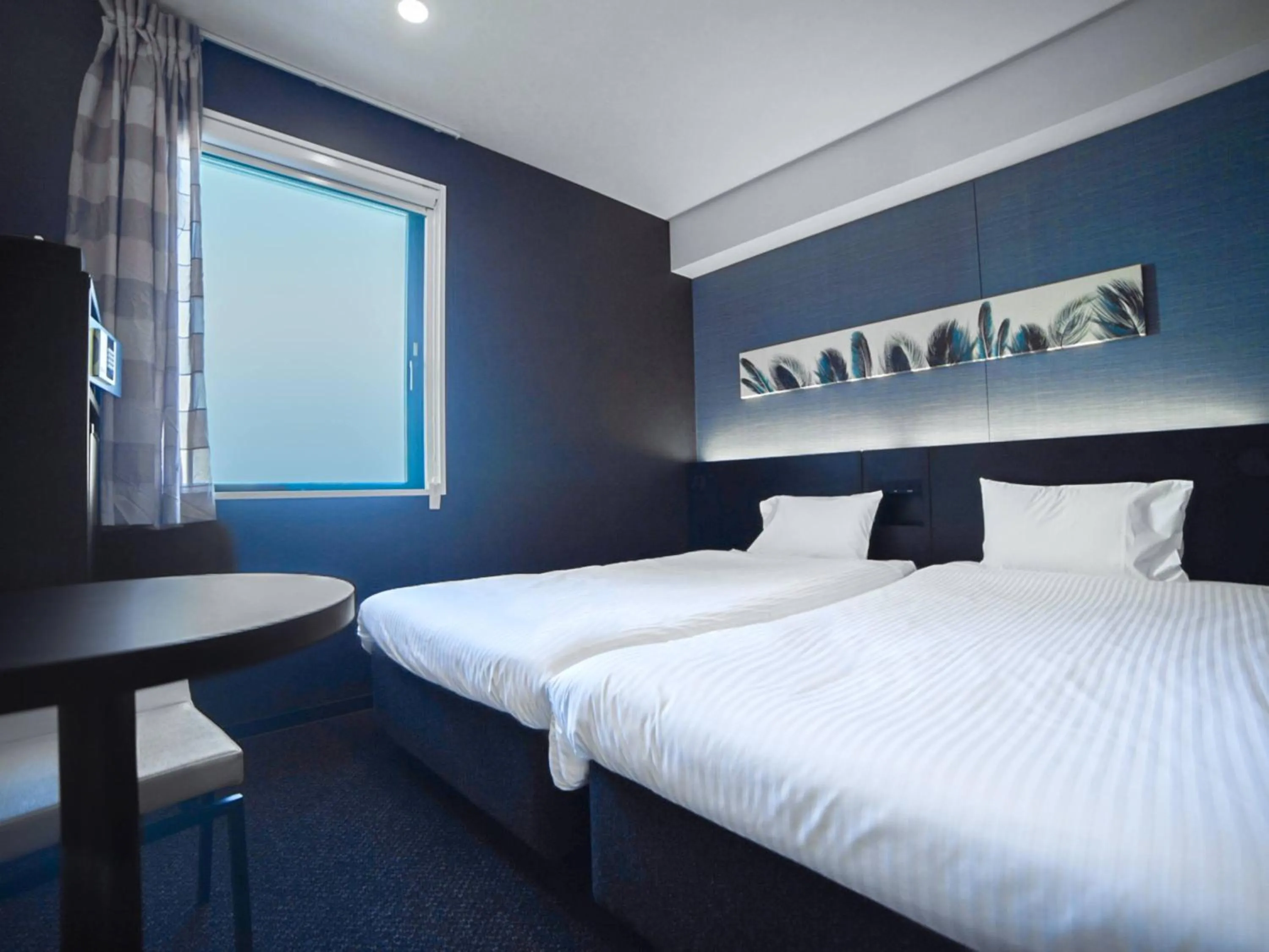 Bed in Henn na Hotel Tokyo Asakusabashi