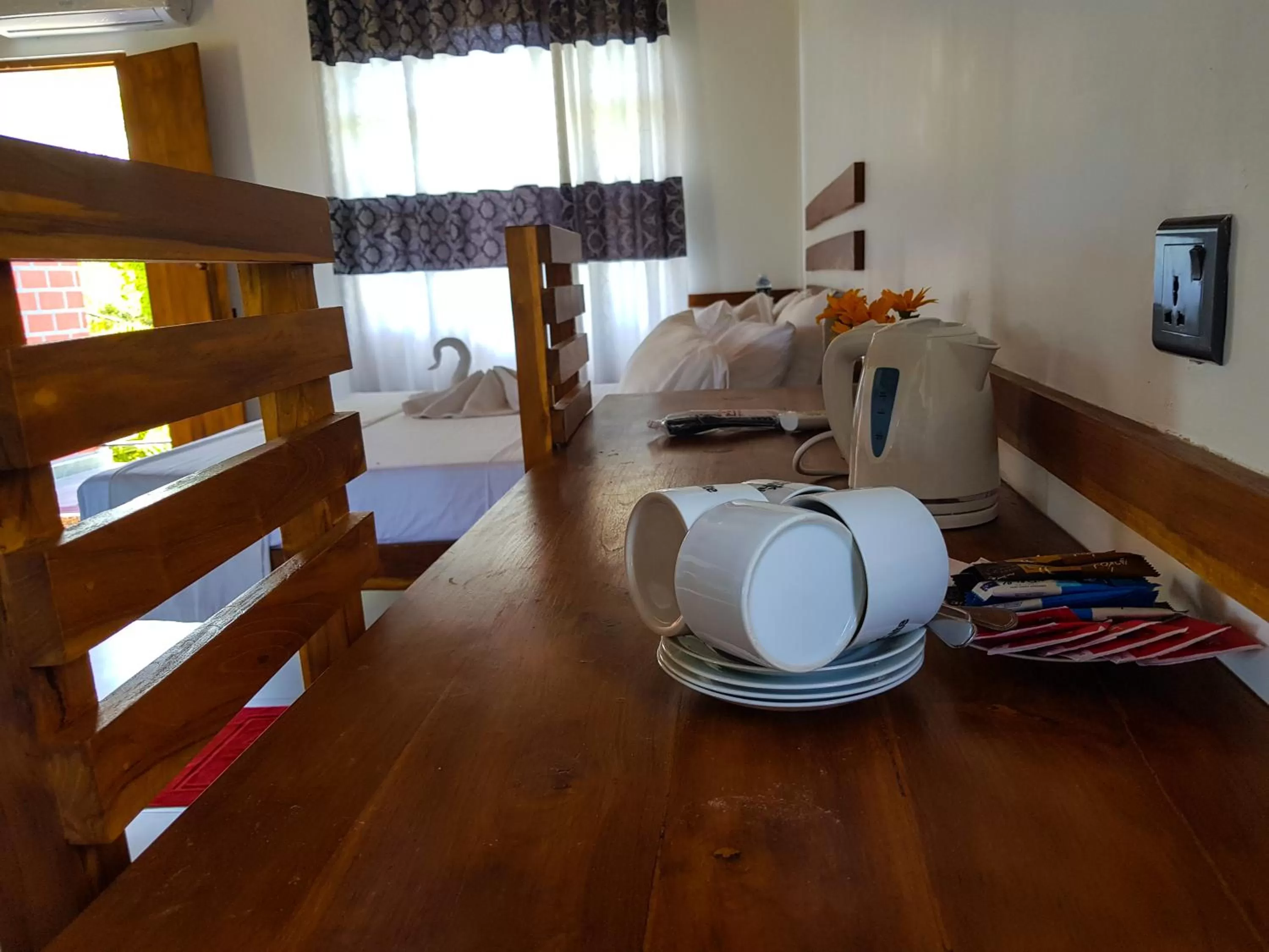 Dining area, Bed in Eco Hotel Black & White - Anuradhapura