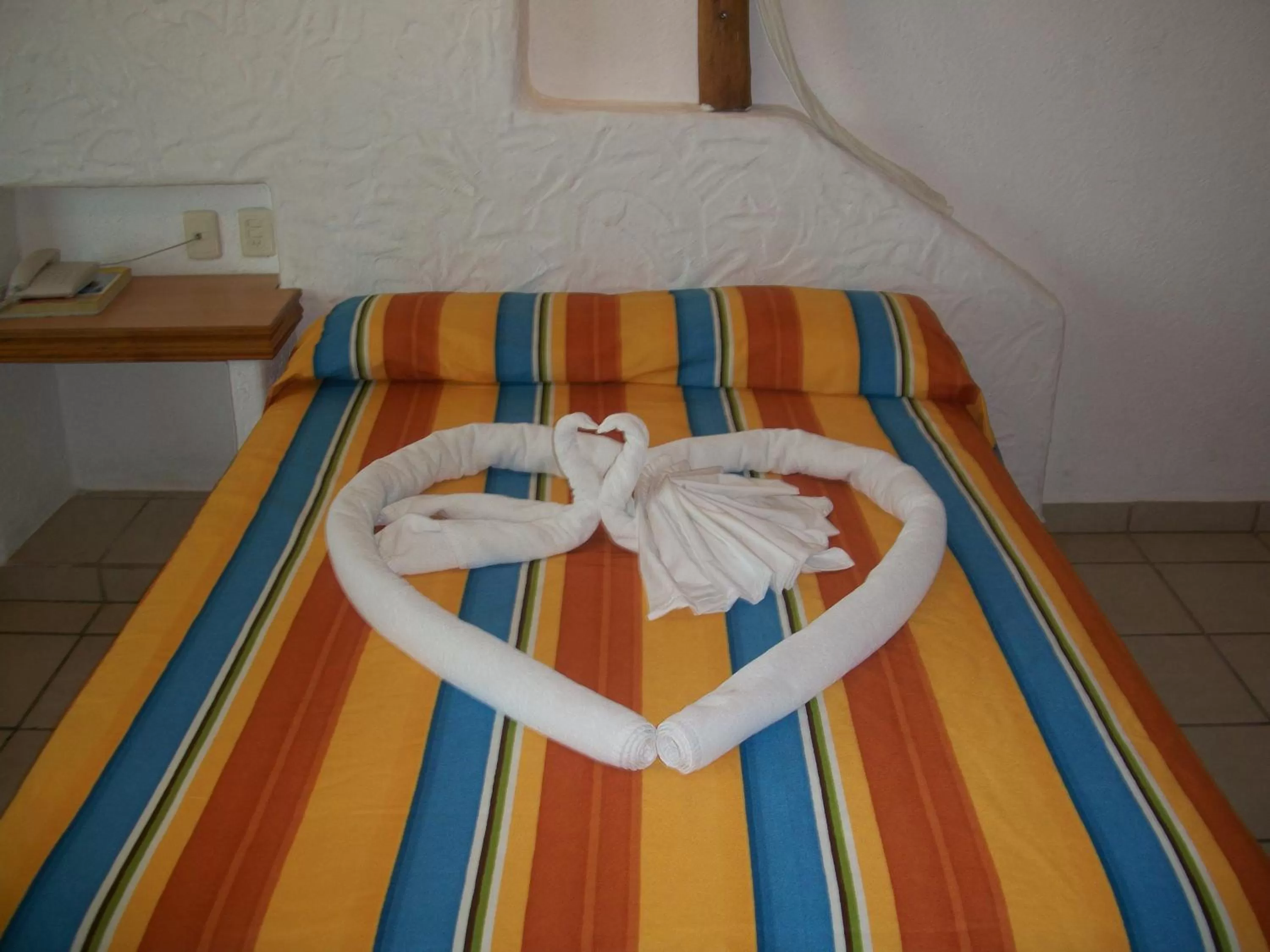 Bed in Hotel Palapa Palace