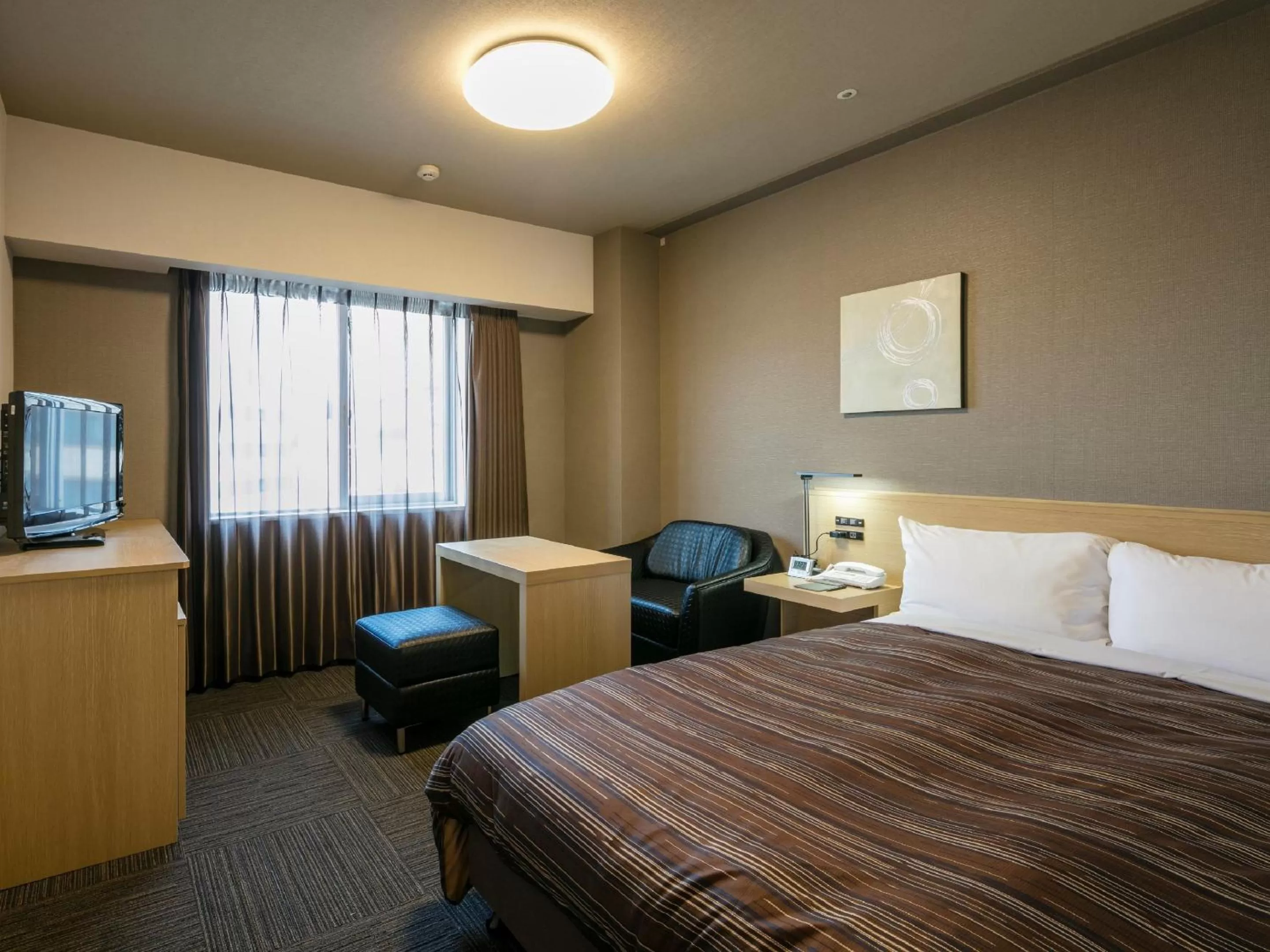 Photo of the whole room, Bed in Hotel Route-Inn Kumamoto Ekimae