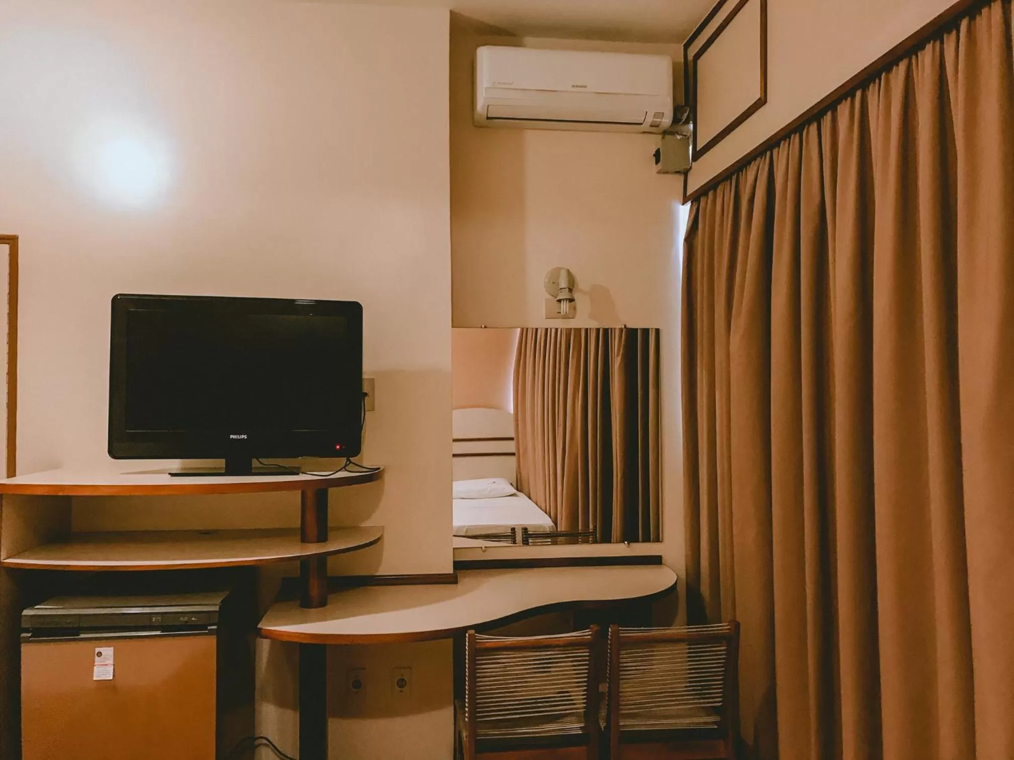 Bedroom, TV/Entertainment Center in Hotel Cataguases