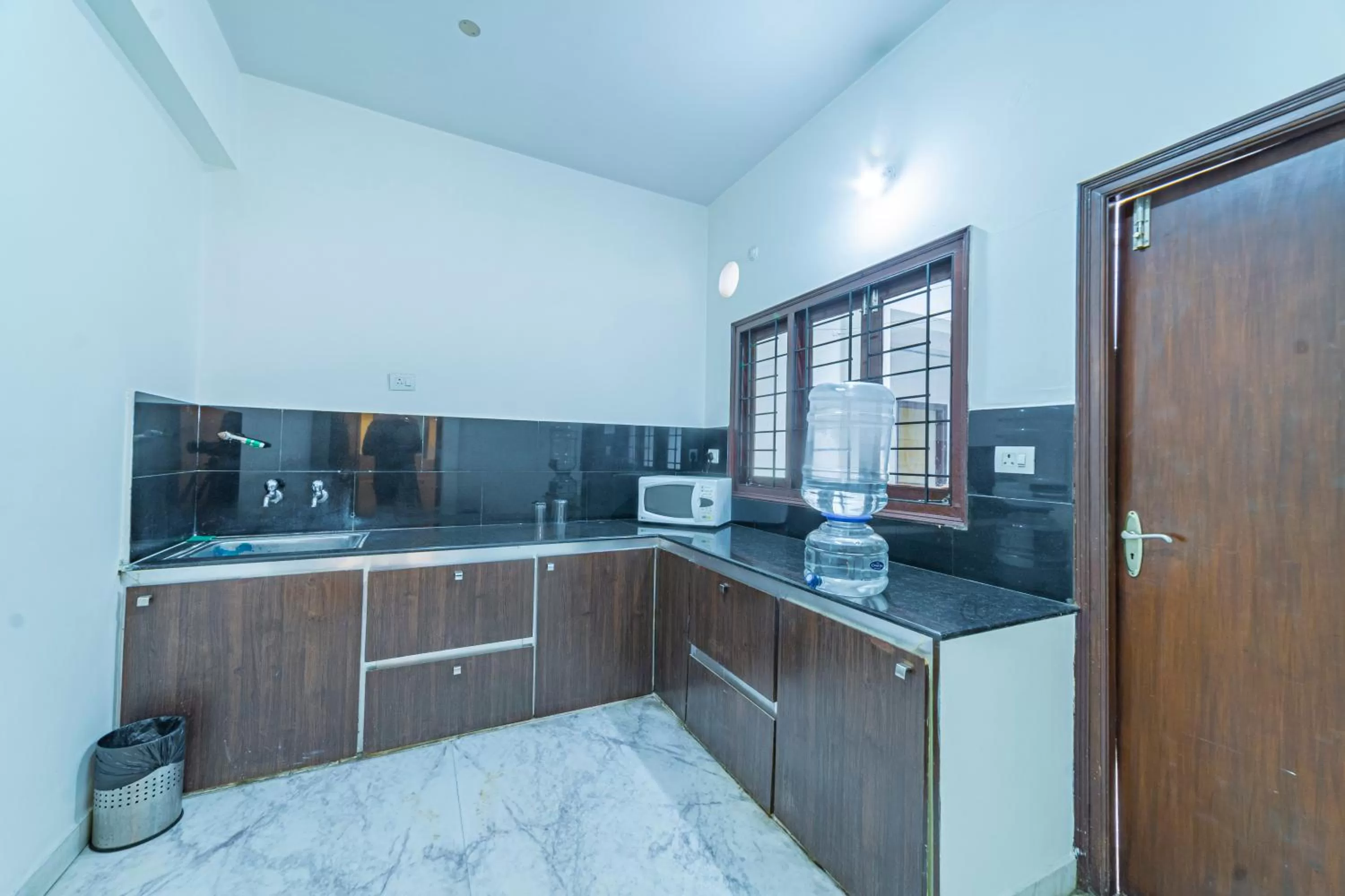 Kitchen or kitchenette in Hotel Athome & Serviced Apartments by Deccan Serai Hotels