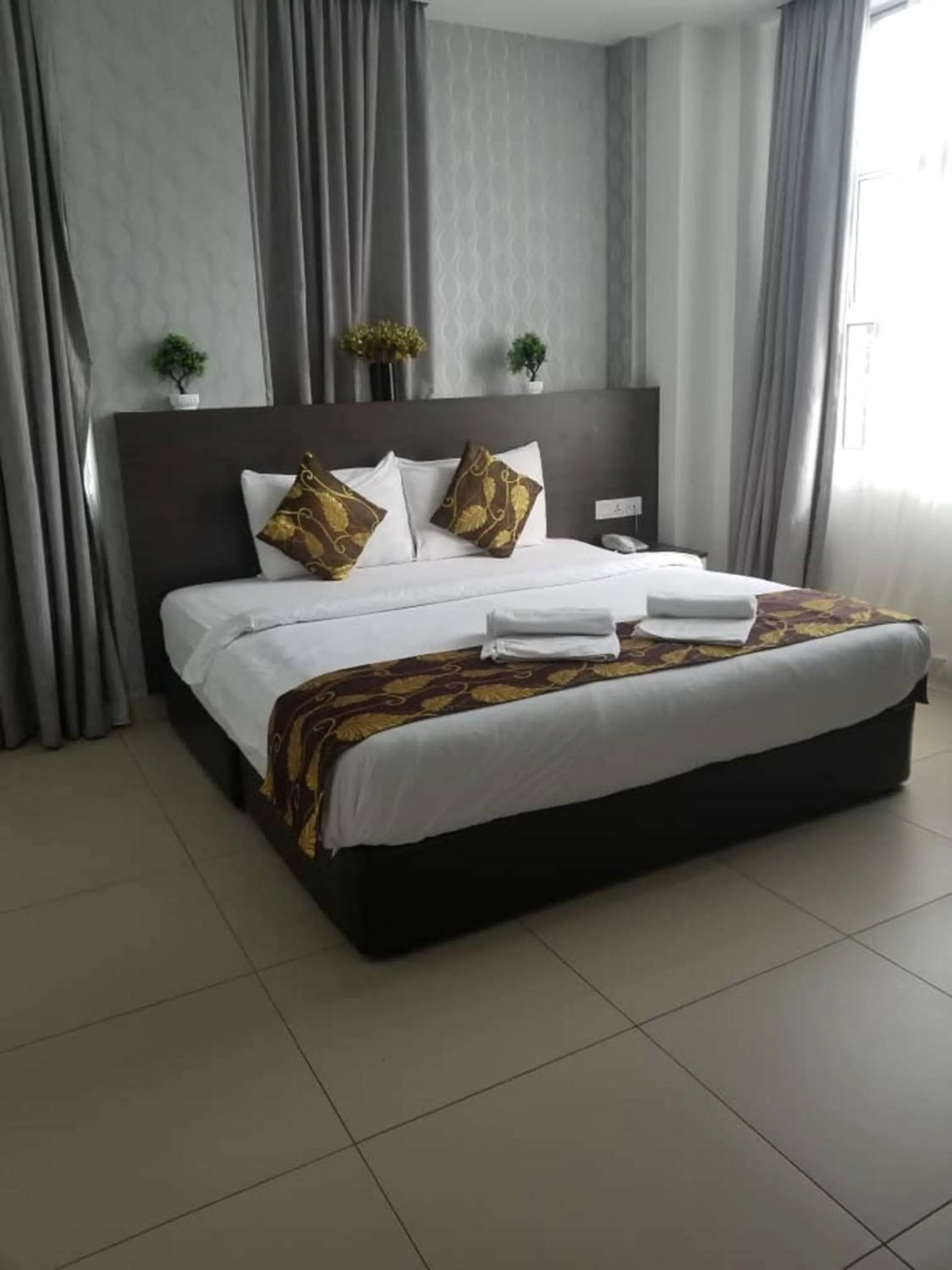 Photo of the whole room, Bed in D'Metro Hotel