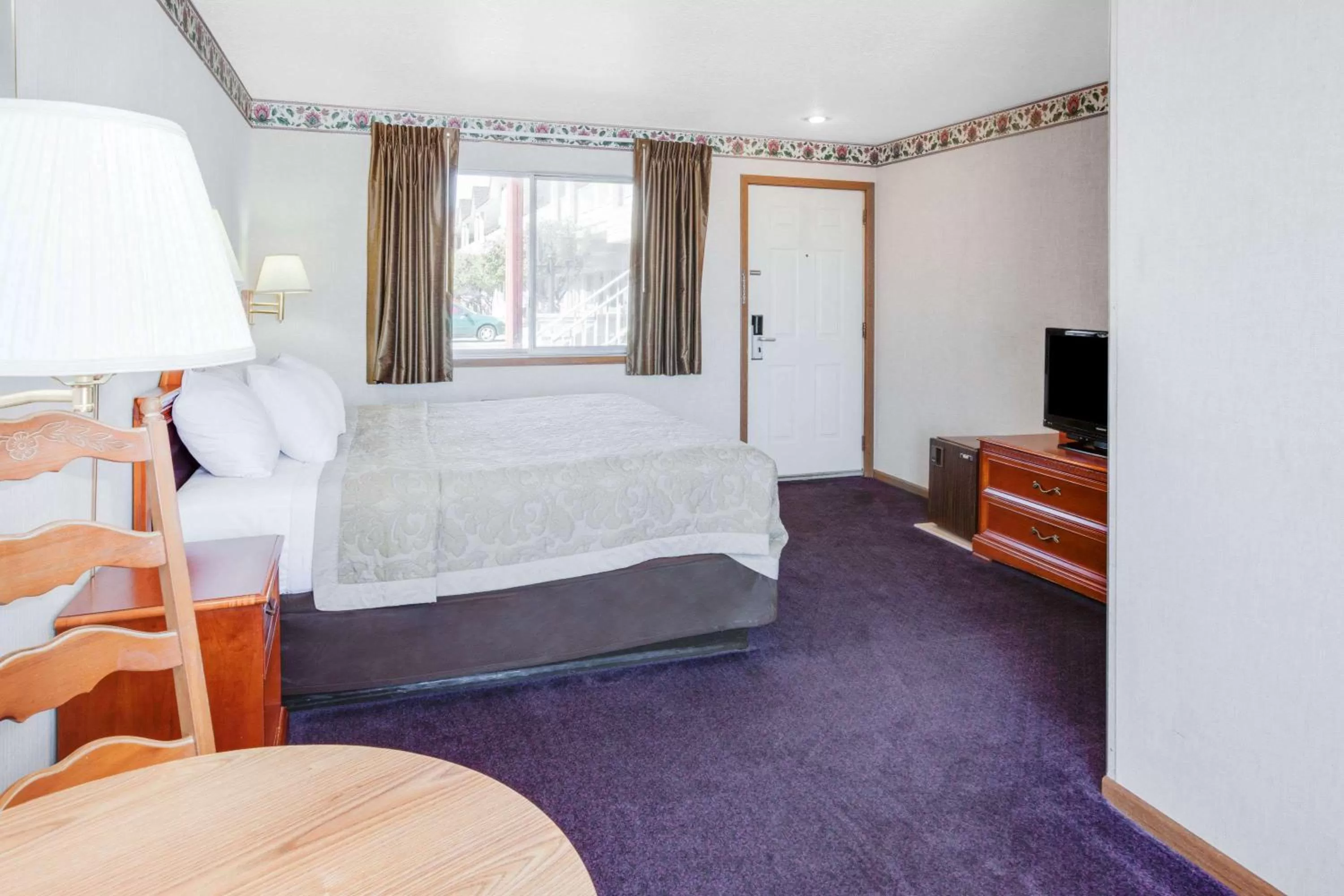 Photo of the whole room in Super 8 Beachfront by Wyndham Mackinaw City, MI