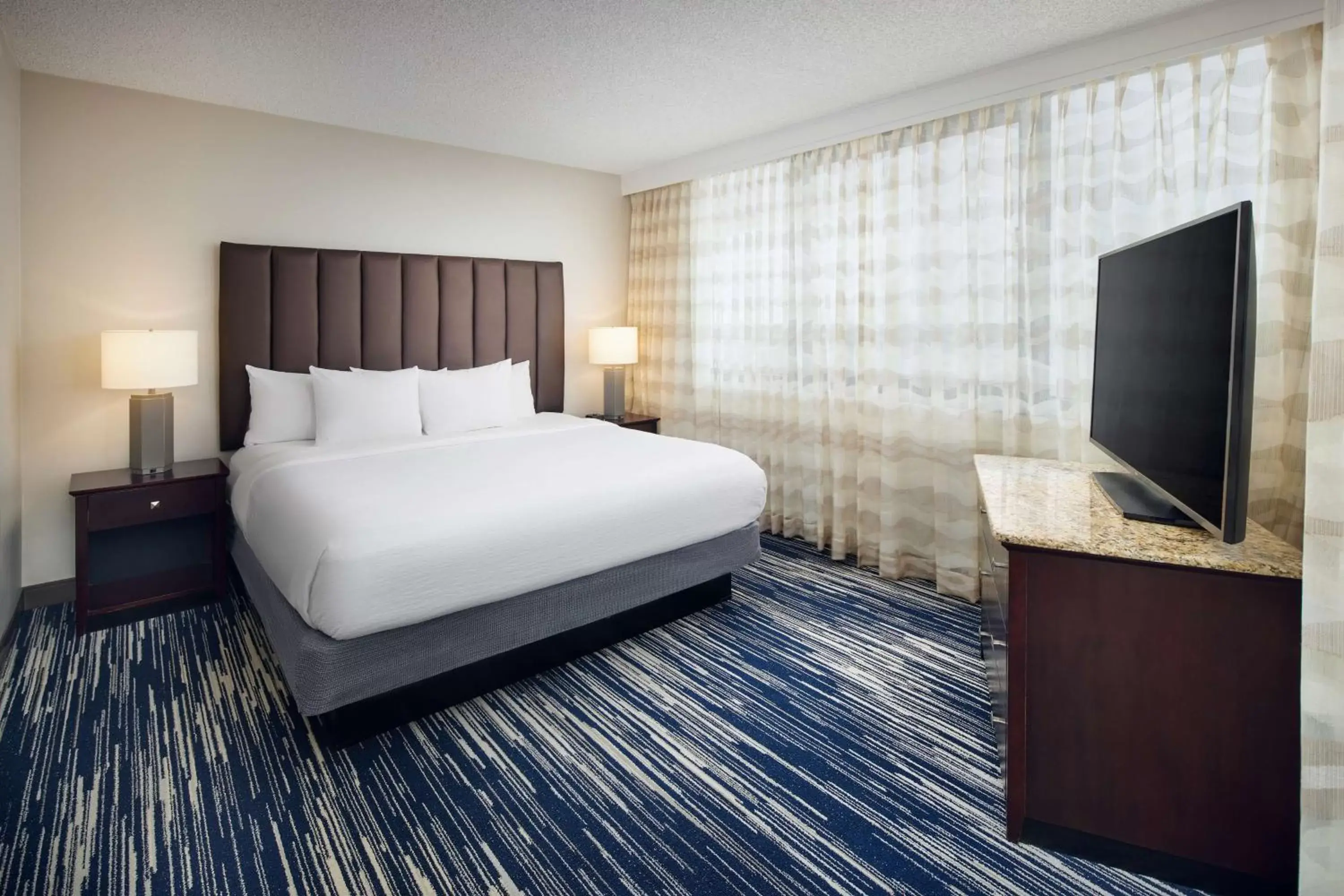 Two-Room Corner King Suite with One King Bed and Sleeper Sofa - Balcony in Embassy Suites by Hilton West Palm Beach Central Two-Room Corner King Suite with One King Bed and Sleeper Sofa - Balcony in Embassy Suites by Hilton West Palm Beach Central