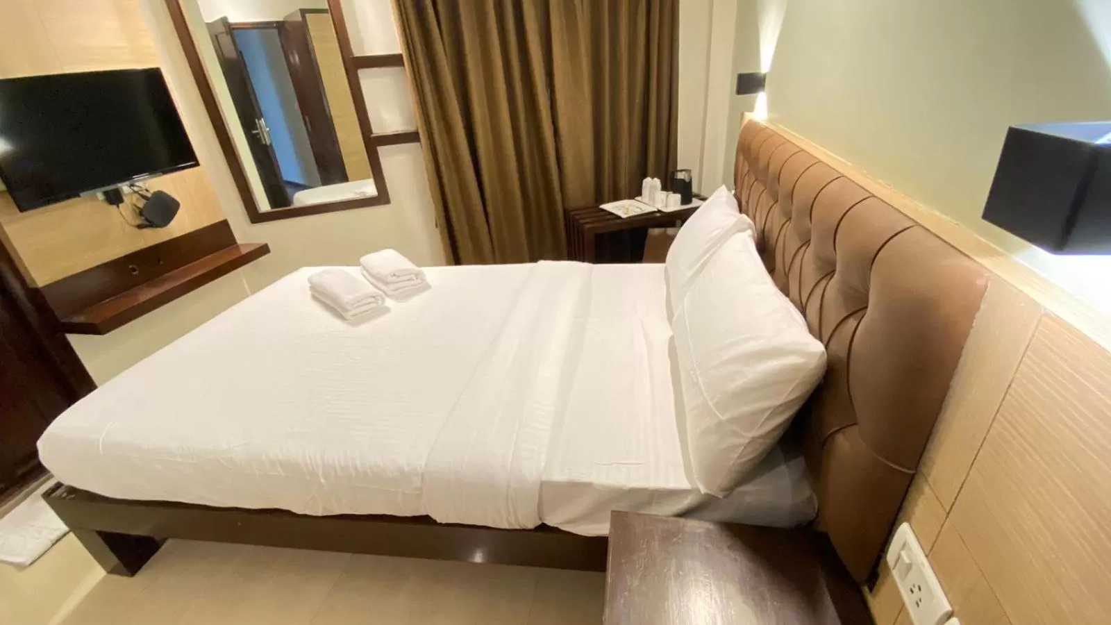 Bed in Hotel Plaza Heights by RAK Rooms, Mangaluru