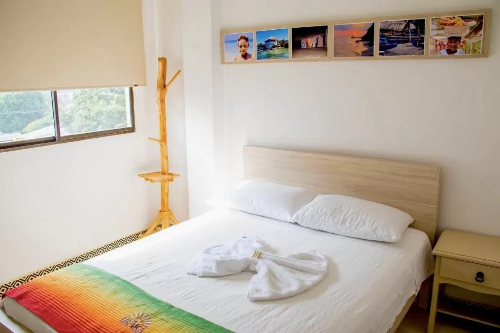 Bed in Hotel Iraka Zenu