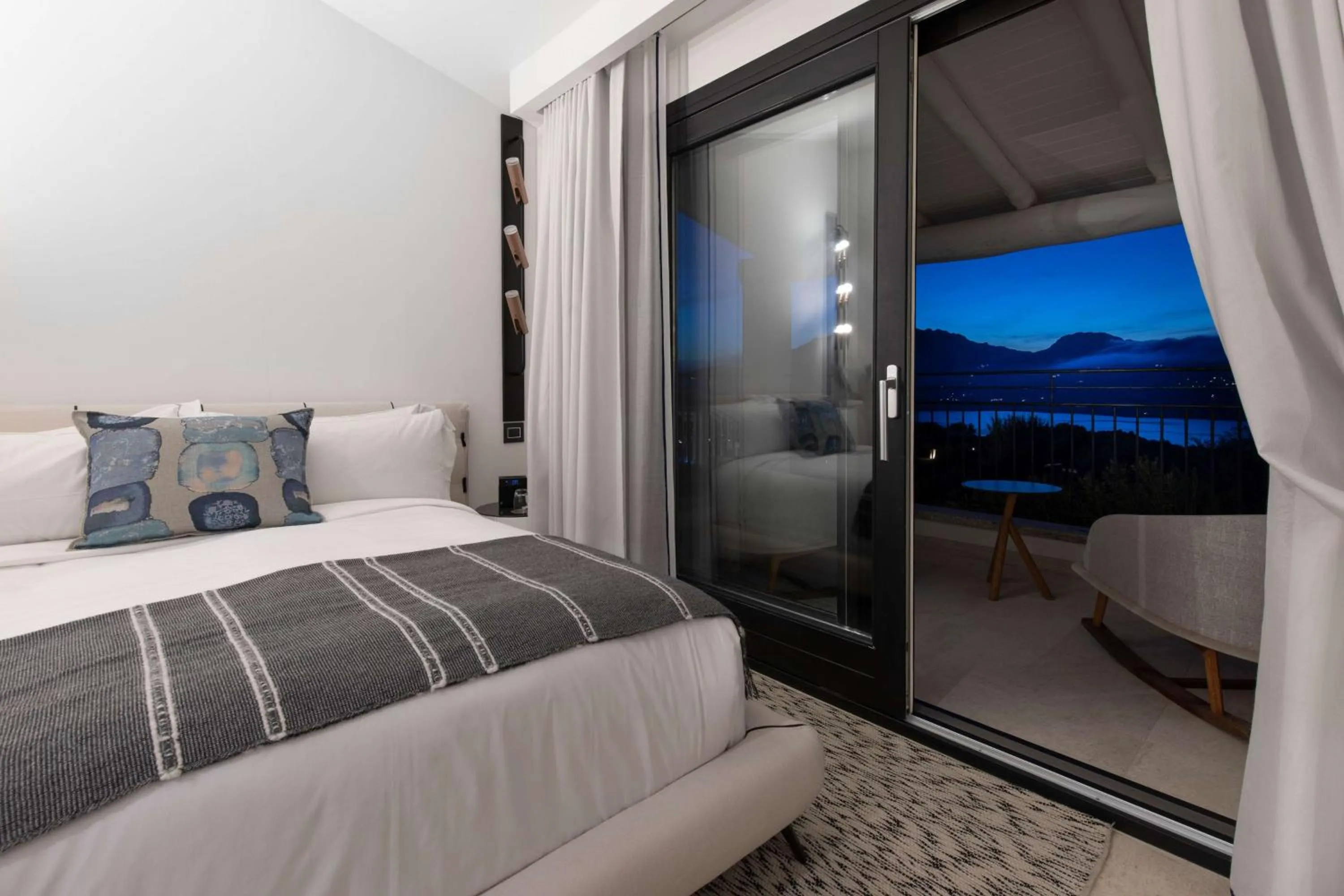 Bed in Sulià House Porto Rotondo, Curio Collection by Hilton