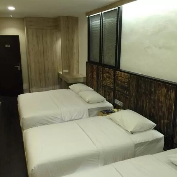 Bed in The Oikos Hotel