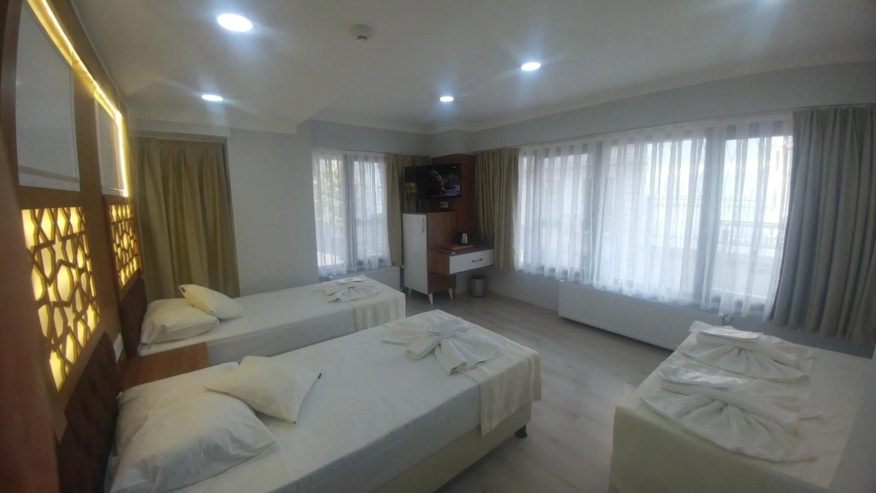 Bed in Grand Liza Hotel