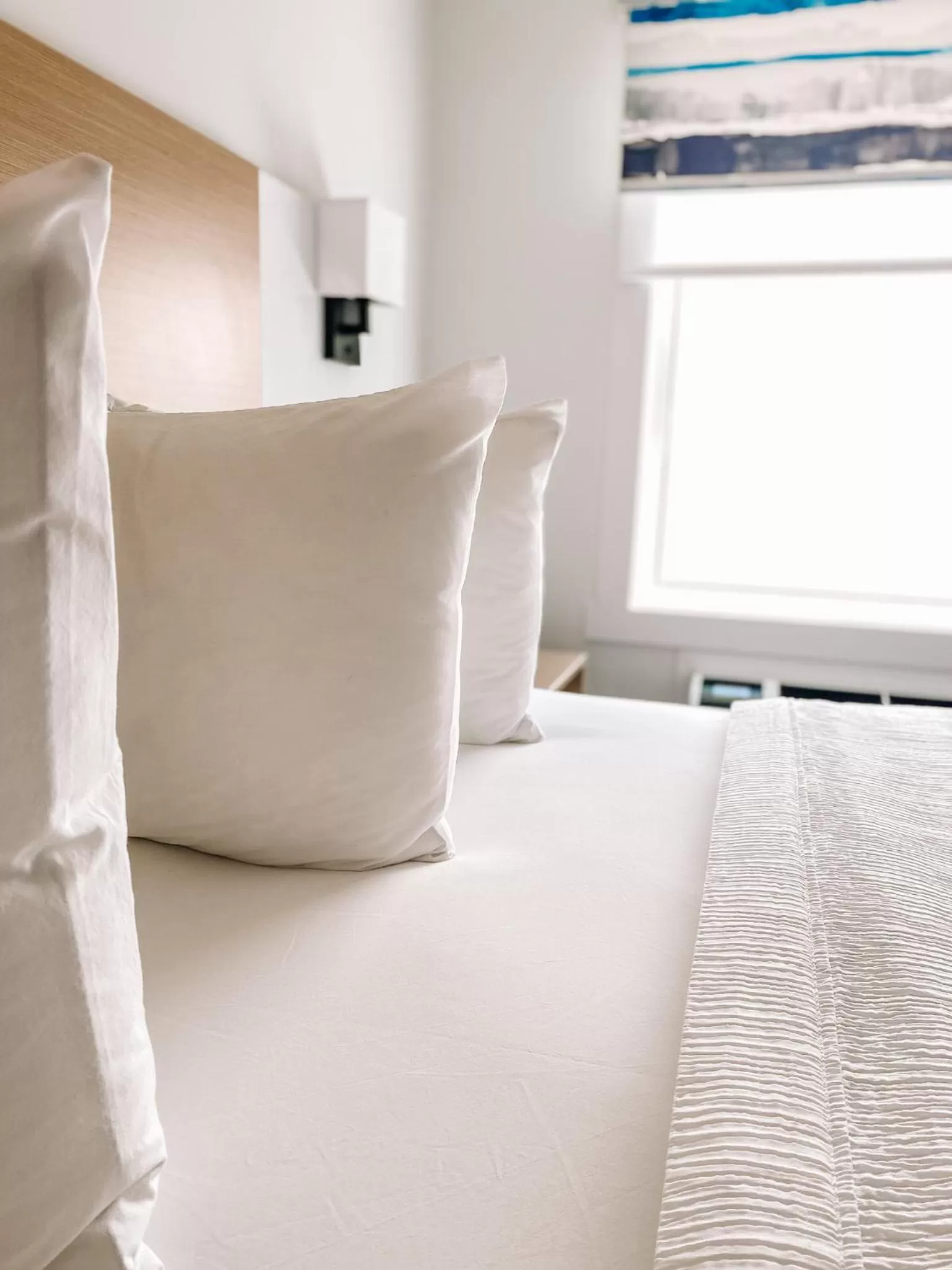 Bed in La Place Rendez-Vous Hotel