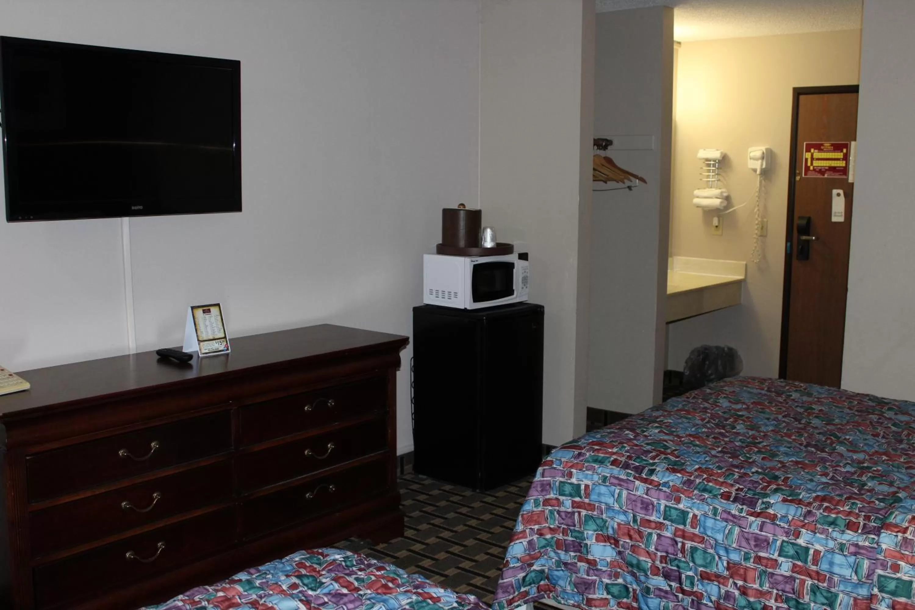 Bedroom, Bed in Coratel Inn and Suites Maple Grove