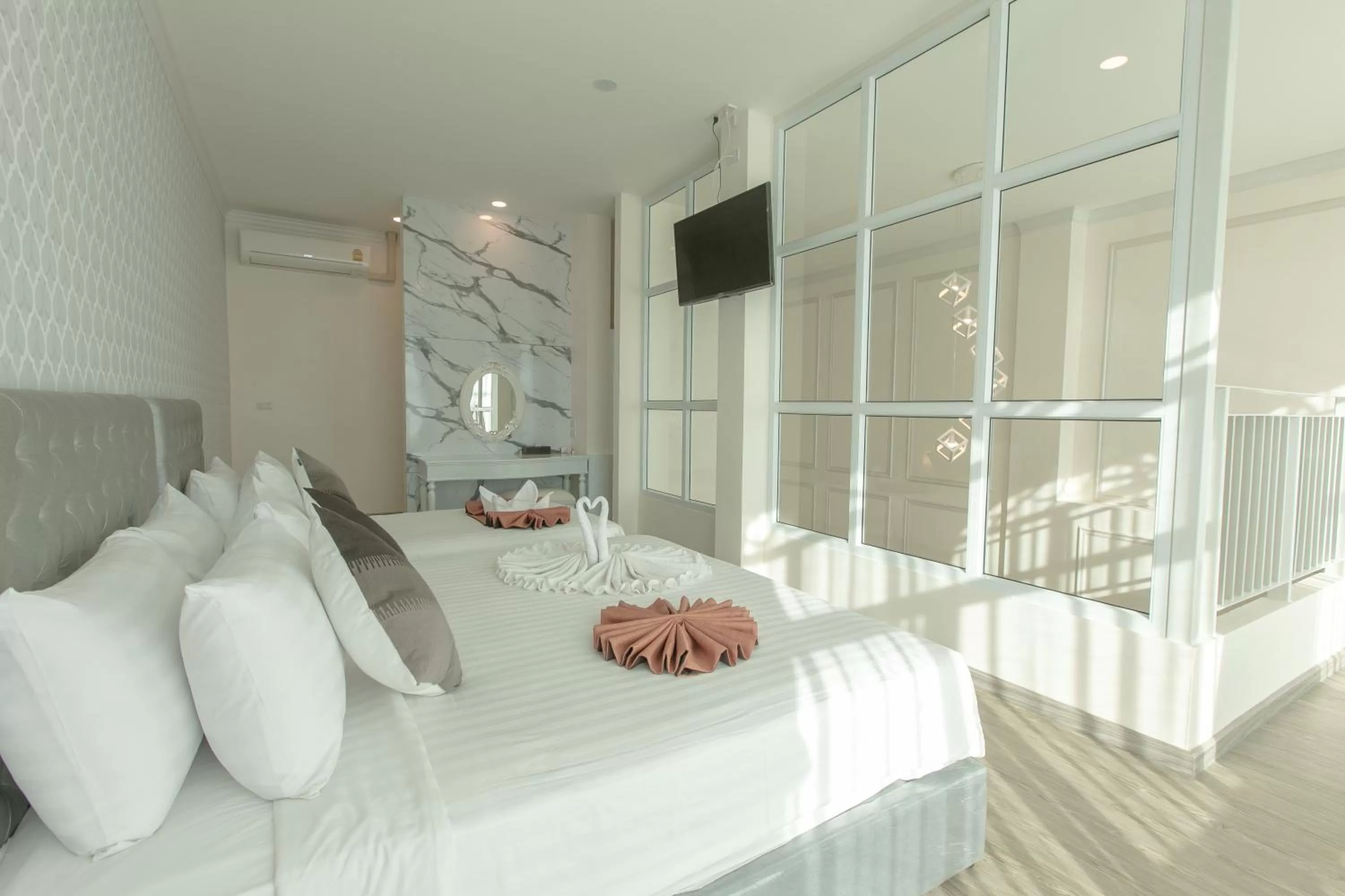 Bed in De Hug Hotel & Residence