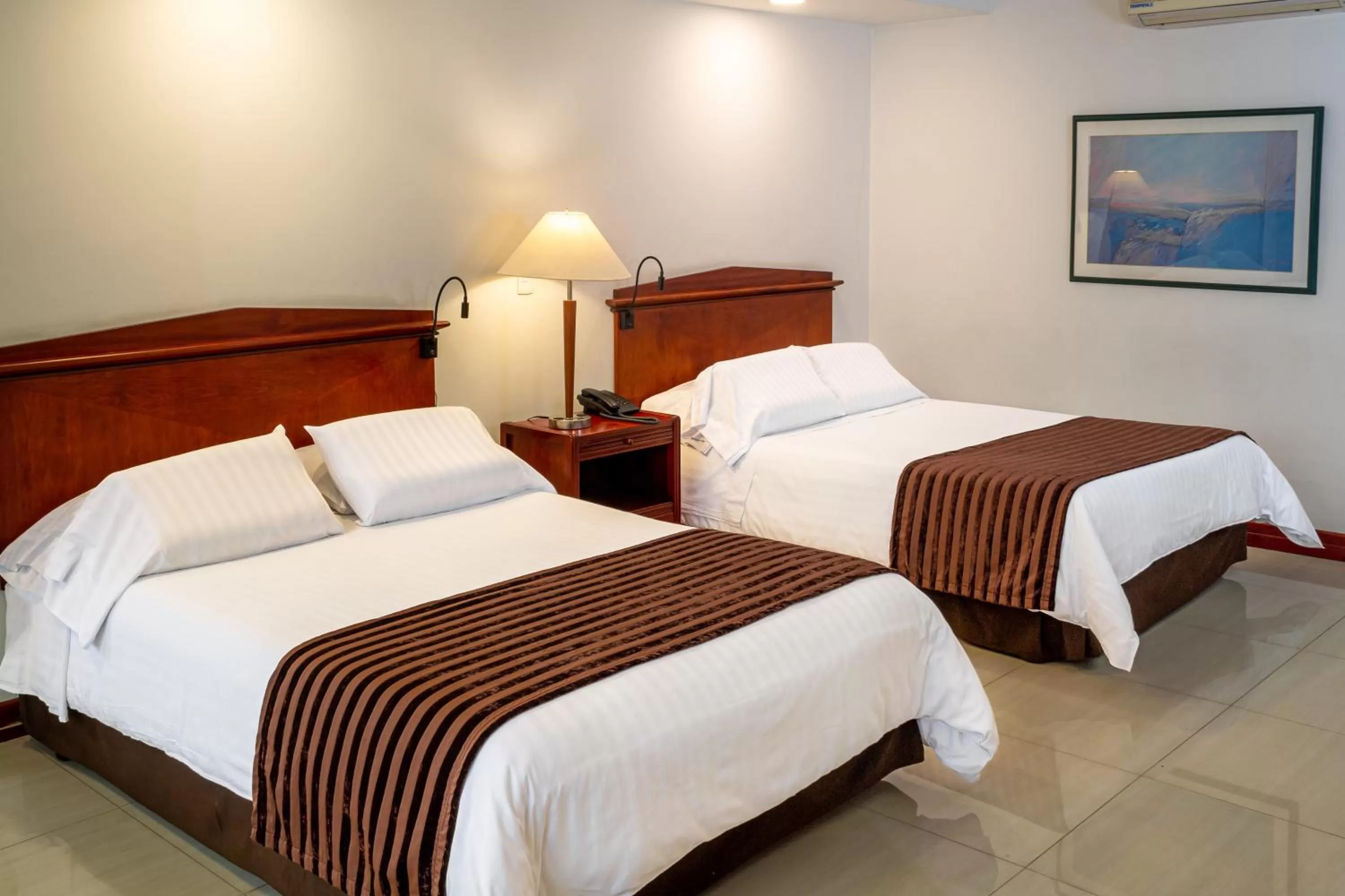 Bed in Torre de Cali Plaza Hotel