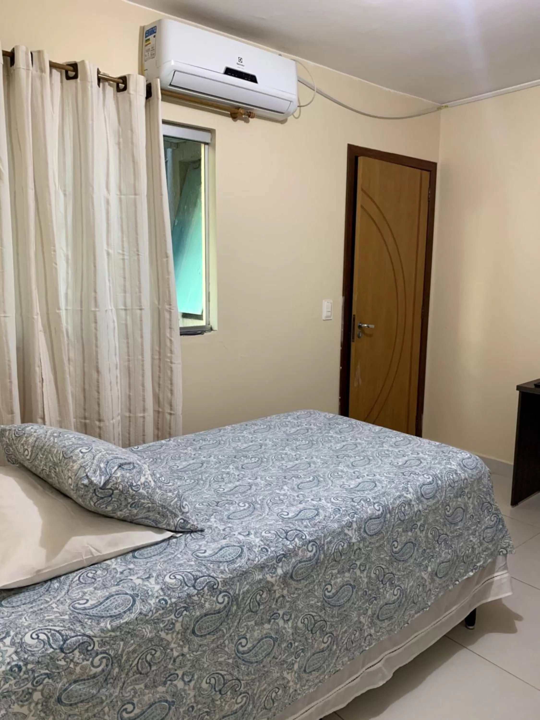 Bed in Pousada Jardim Brasília