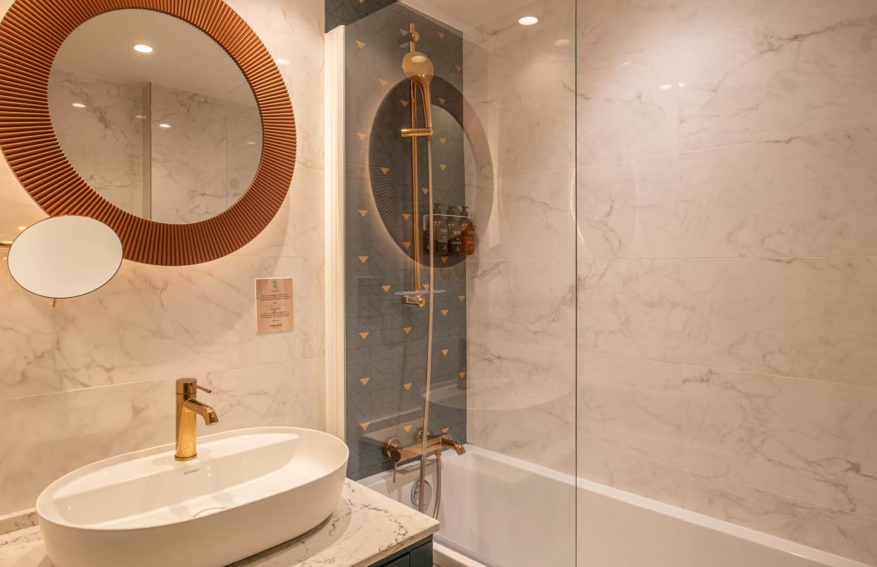 Bathroom in Hôtel Le Tourville by Inwood Hotels