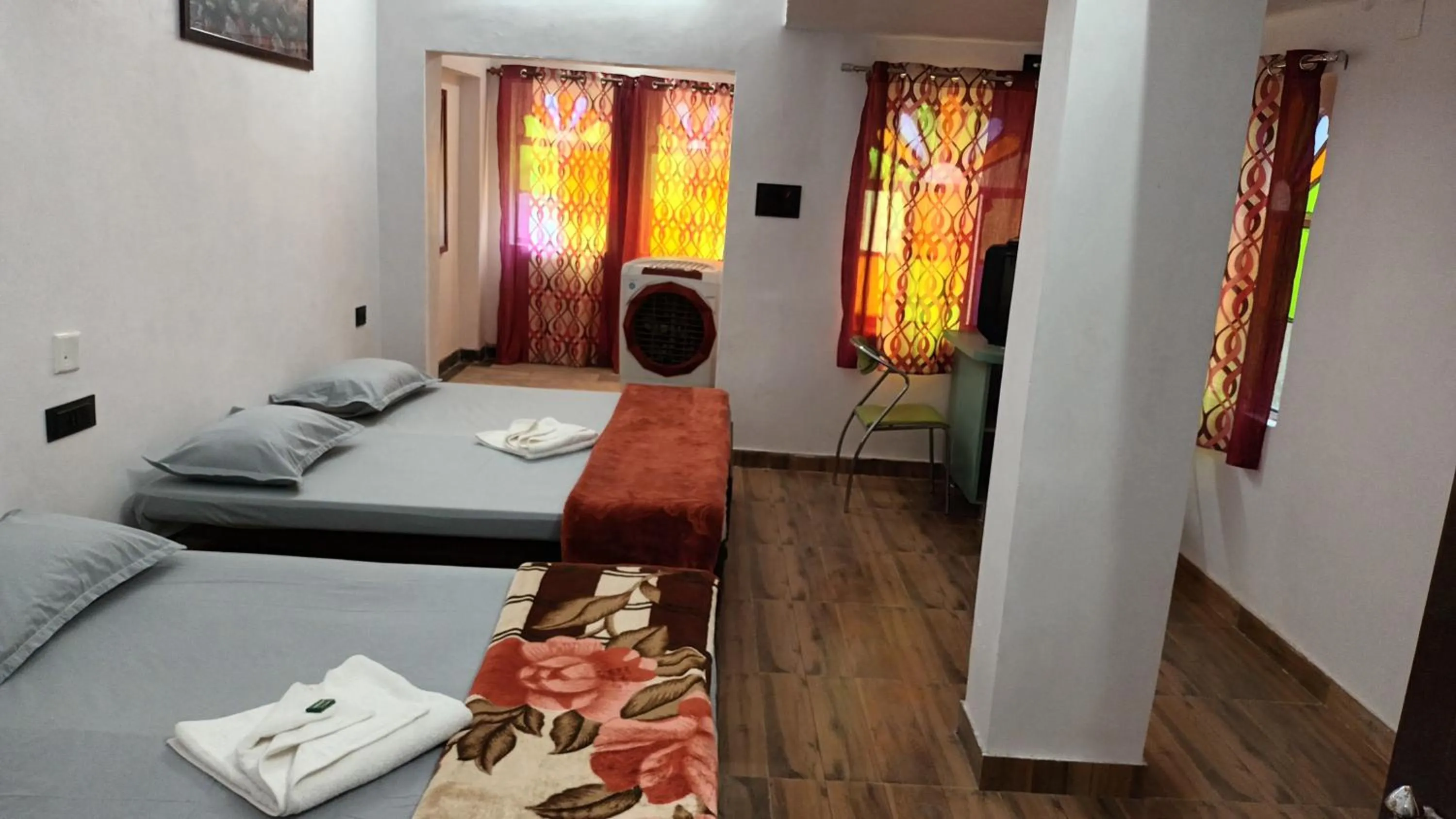 Photo of the whole room, Bed in Jag Niwas Guest House & pure veg restaurant