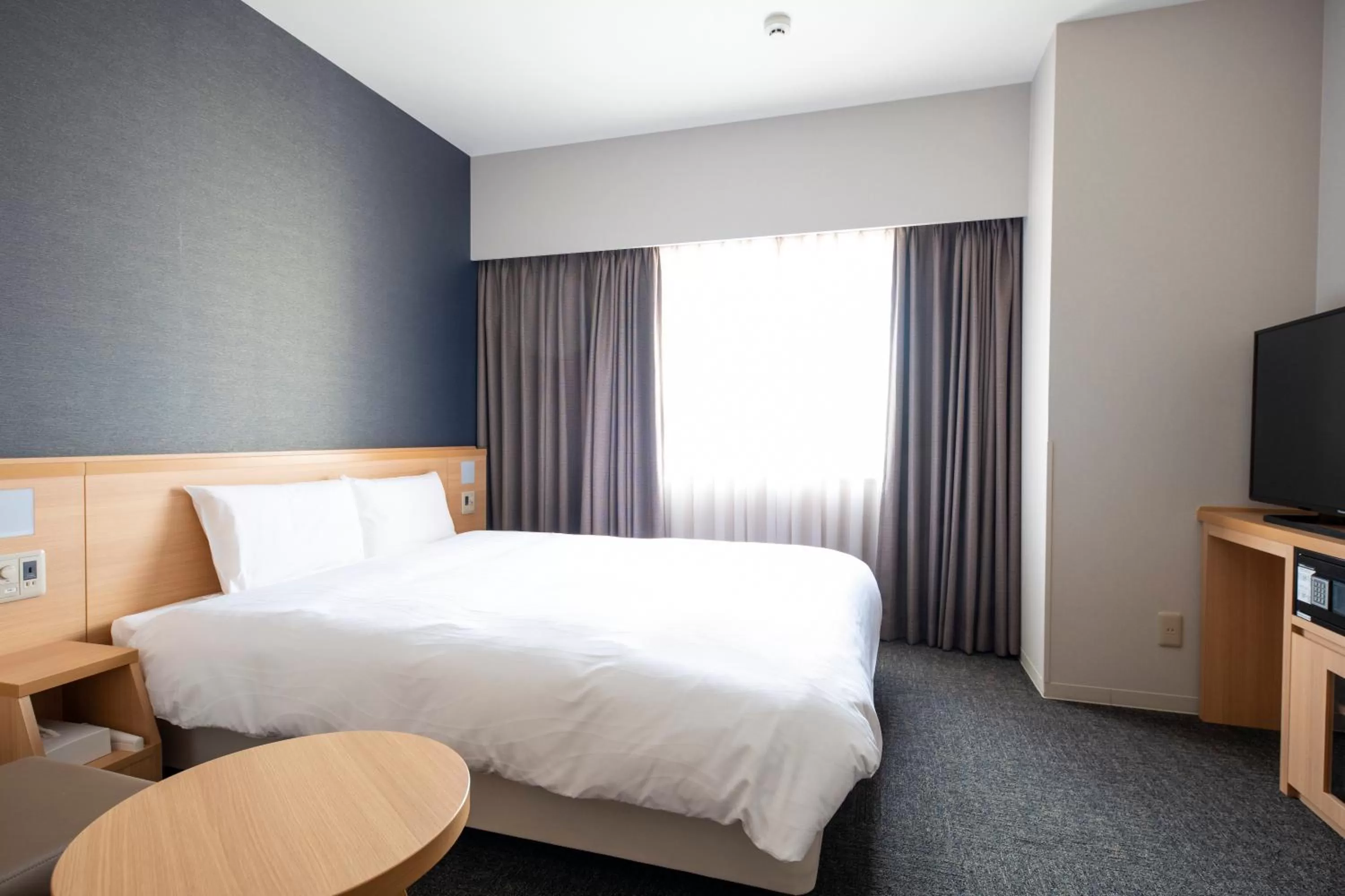 Bed in Dormy Inn Premium Nagasaki Ekimae