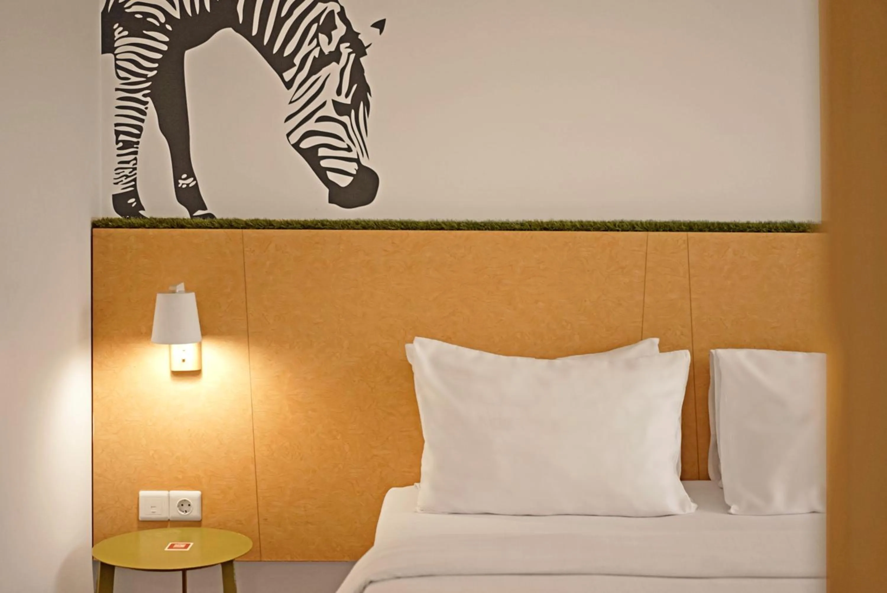 Bed in Malaka Hotel Bandung