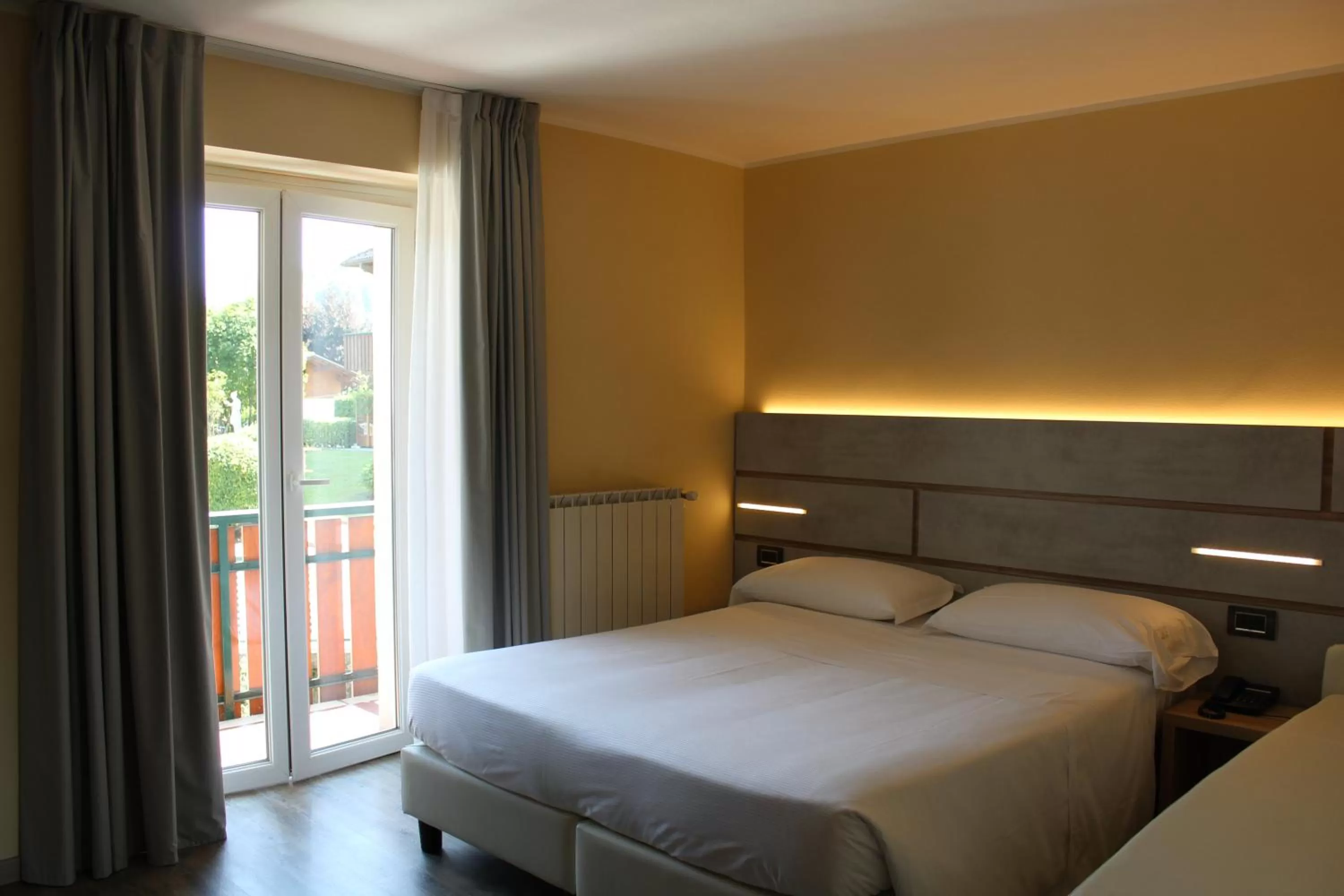 Photo of the whole room, Bed in Harmony Suite Hotel