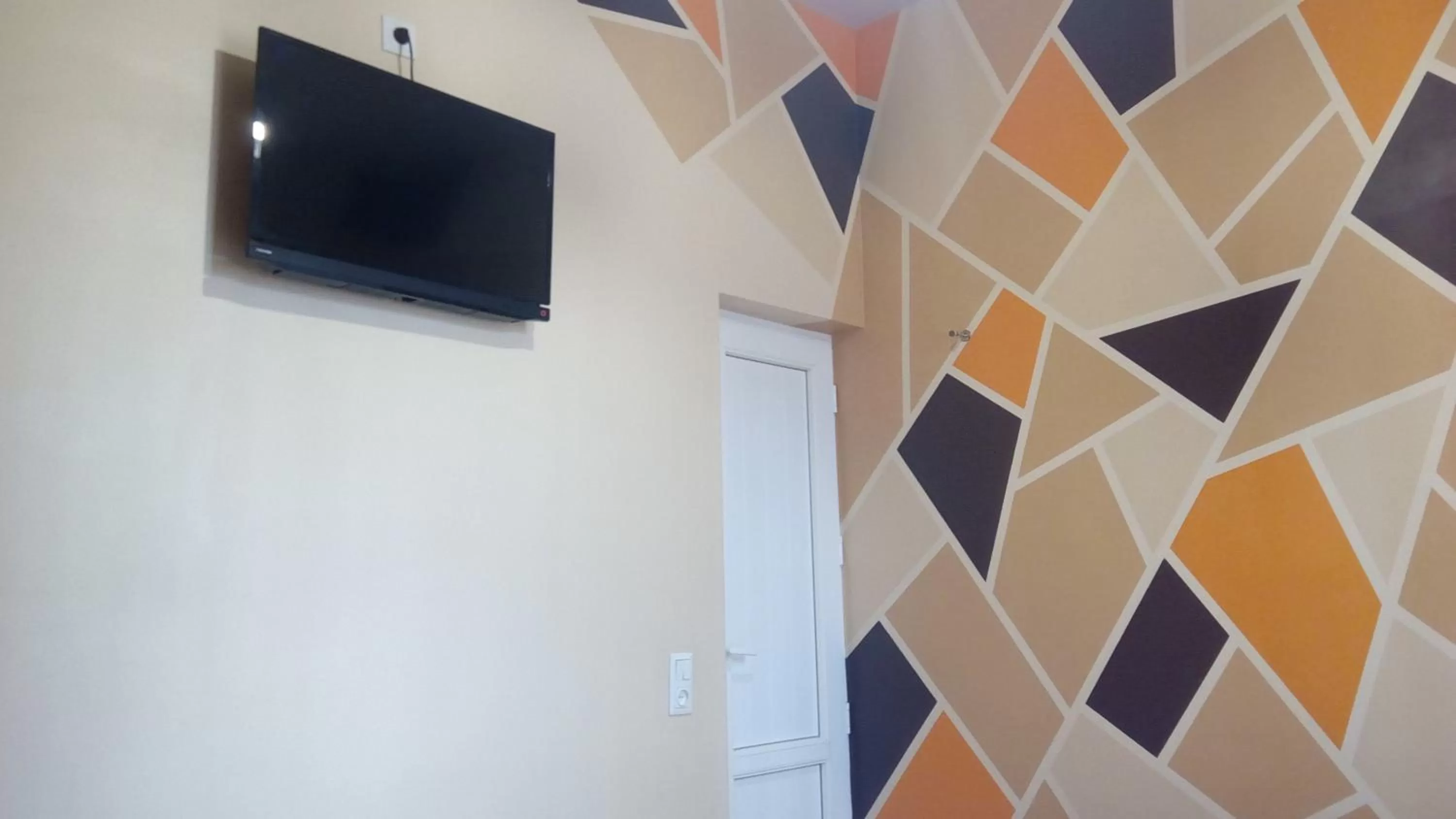 TV and multimedia, TV/Entertainment Center in Hotel Isani