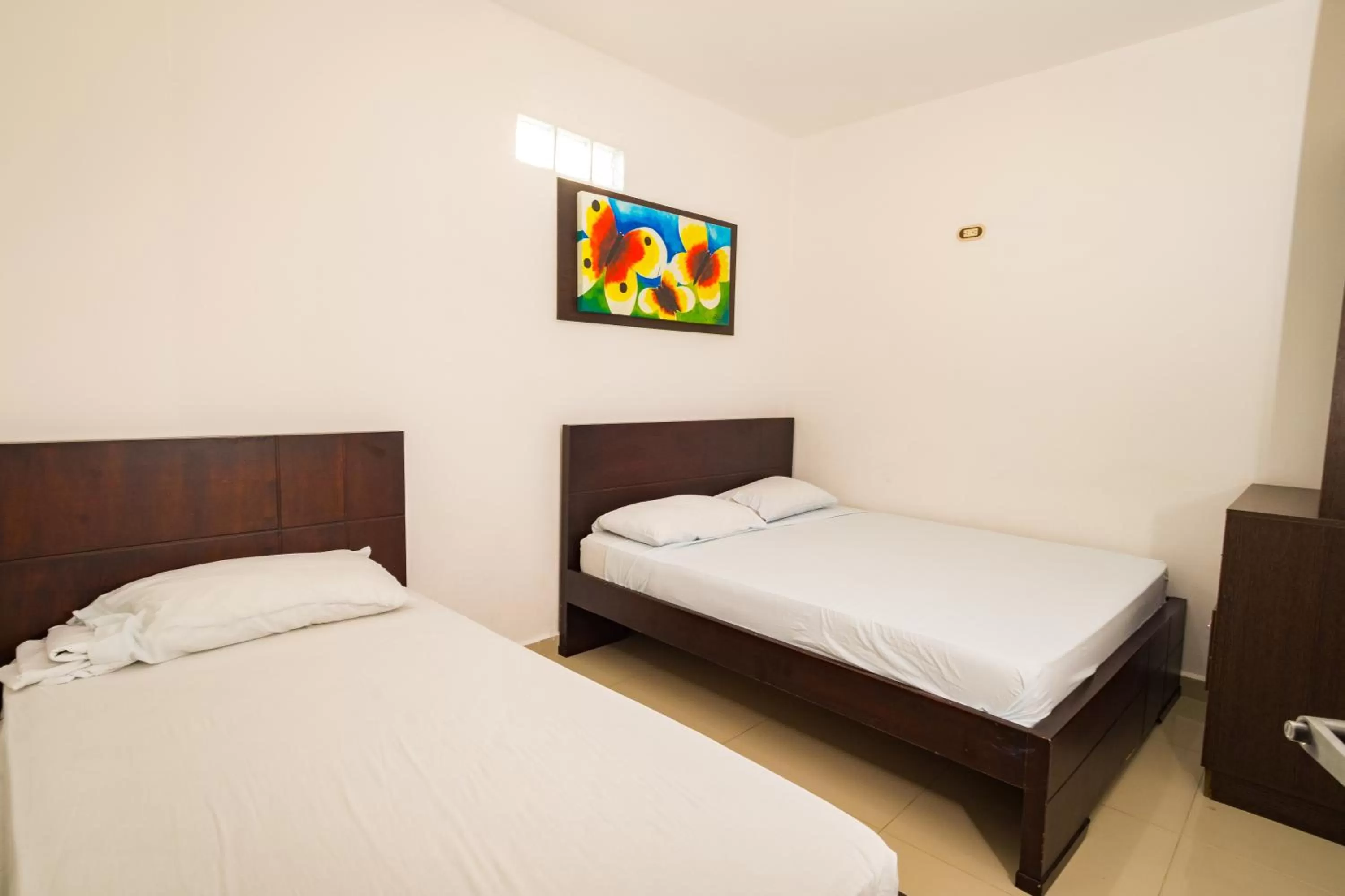 Bed in Genesis Hotel