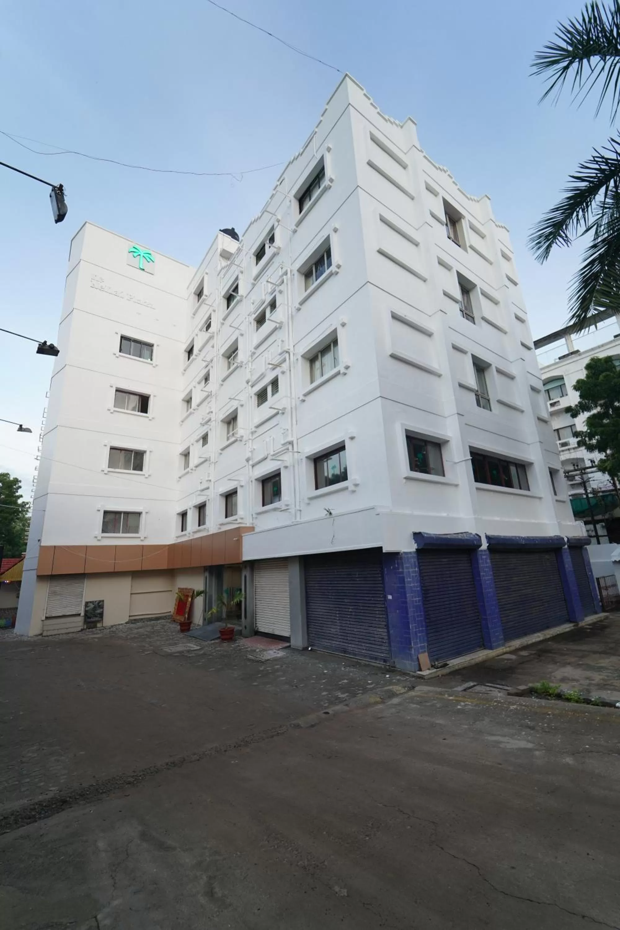 Property building in Hotel Palmyra Grand Inn