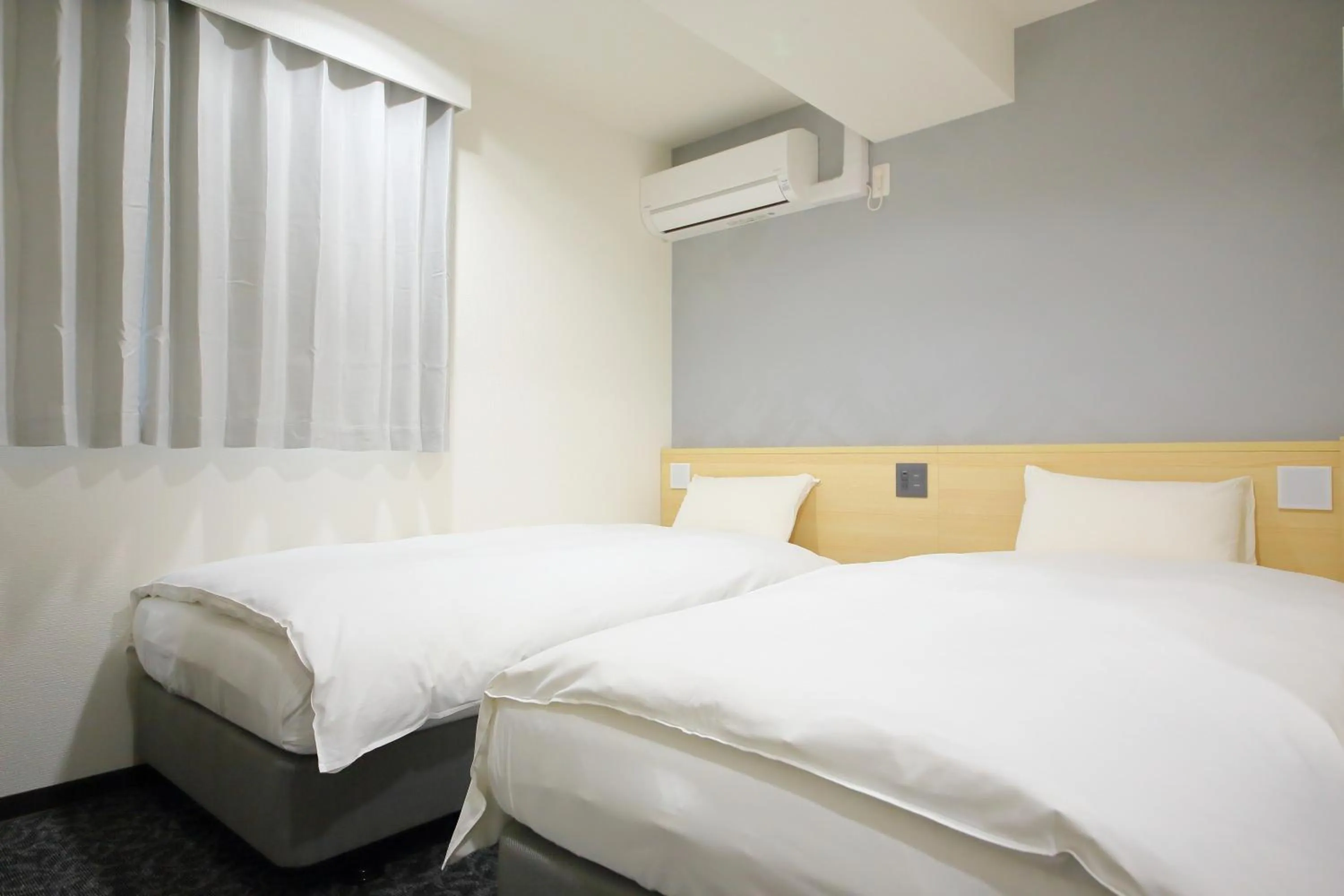 Bed in Hotel Shin-Imamiya