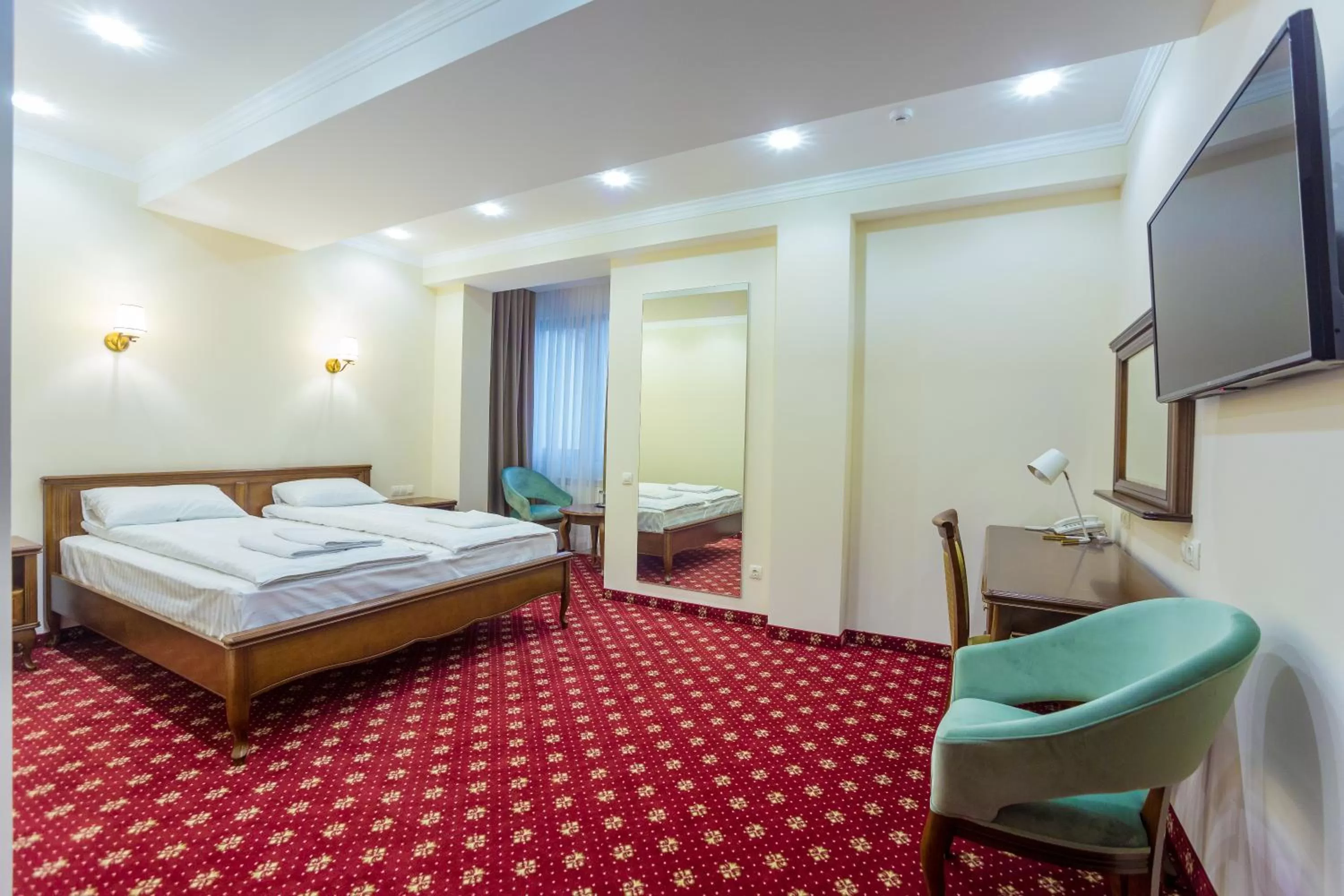 Photo of the whole room, Bed in Ambassador Hotel