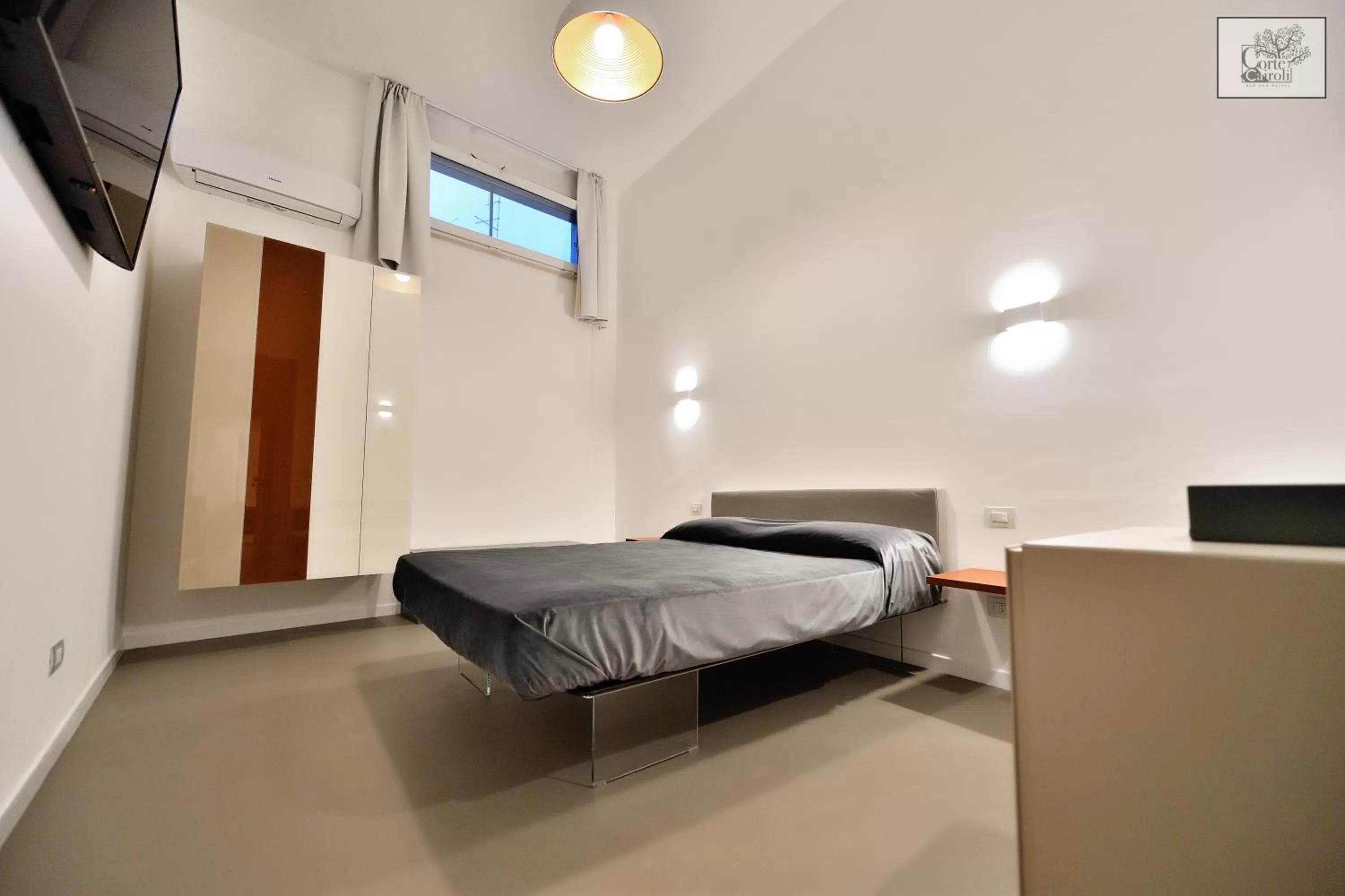 Bed in Corte Cairoli B&B and Suites