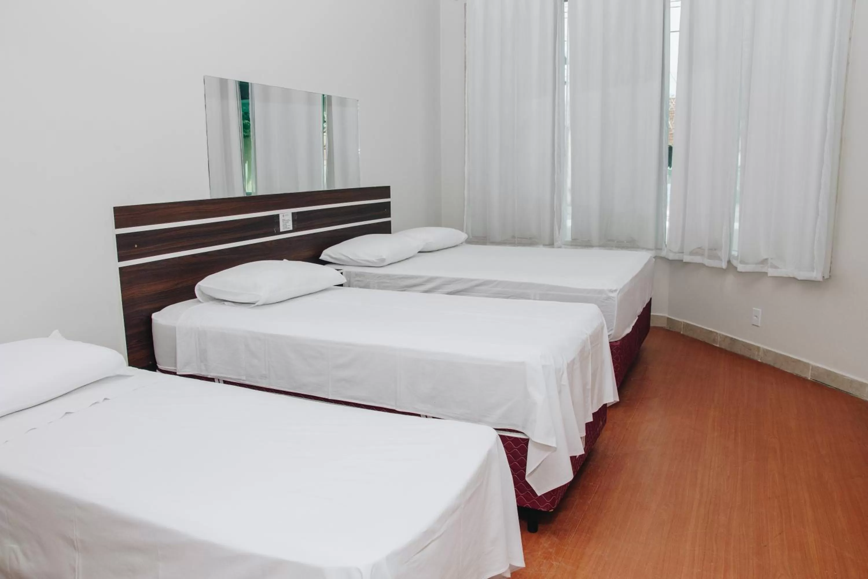 Bed in SAMIR HOTEL COMFORT