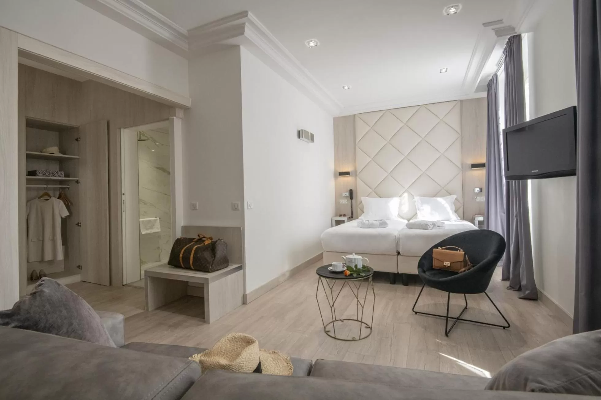 Photo of the whole room, Bed in GOLDEN TULIP CANNES HOTEL de PARIS