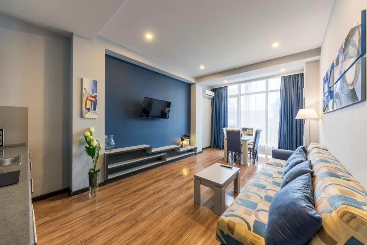 Communal lounge/ TV room in Sani Apart Hotel