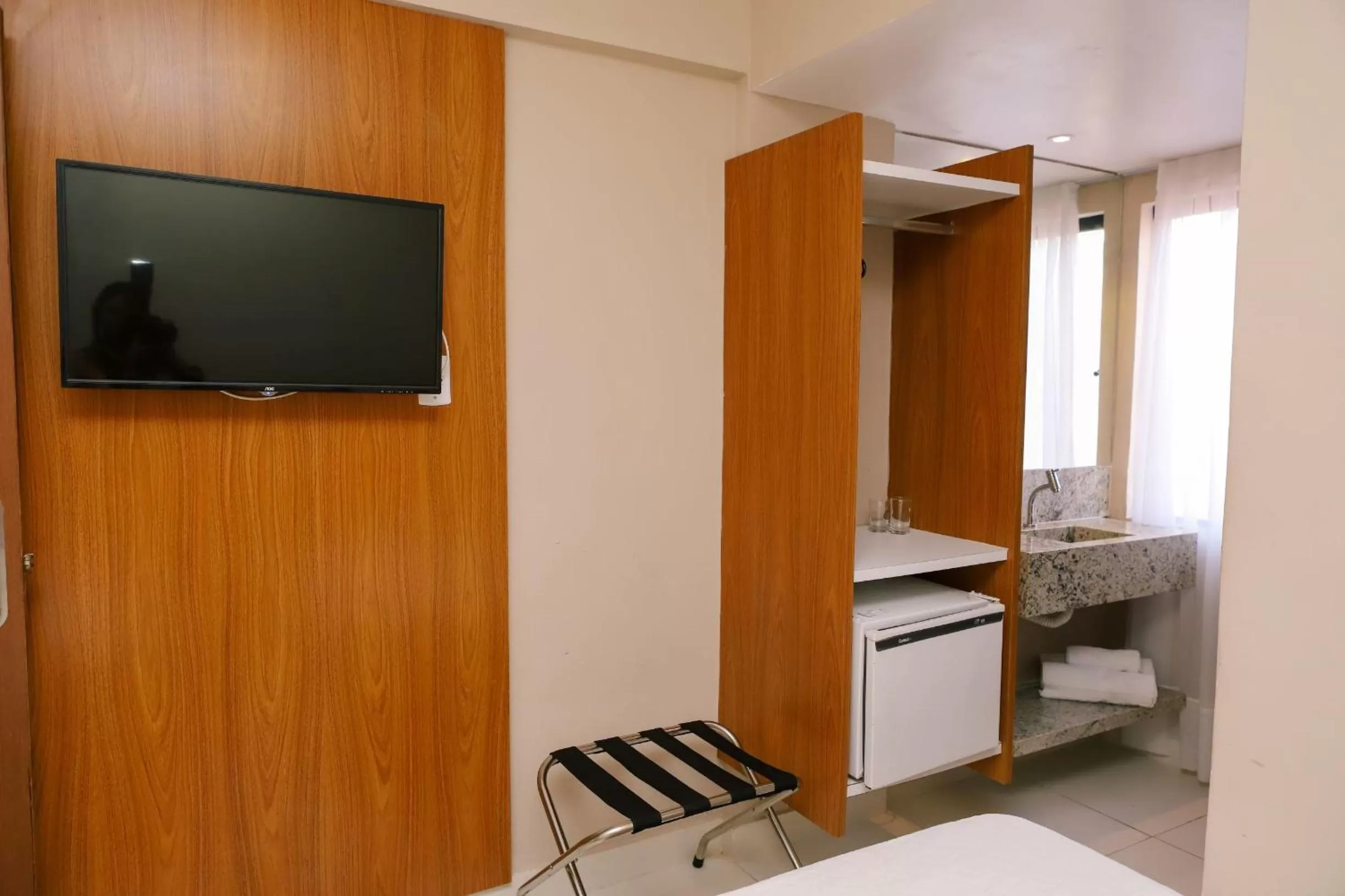 TV and multimedia in Porto Suítes Natal Hotel