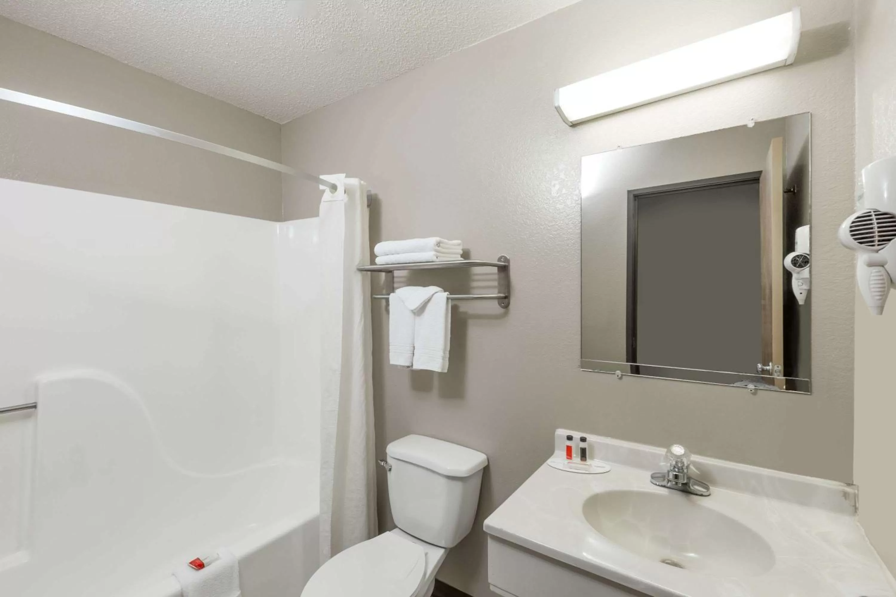 Bathroom in Super 8 by Wyndham Hays KS